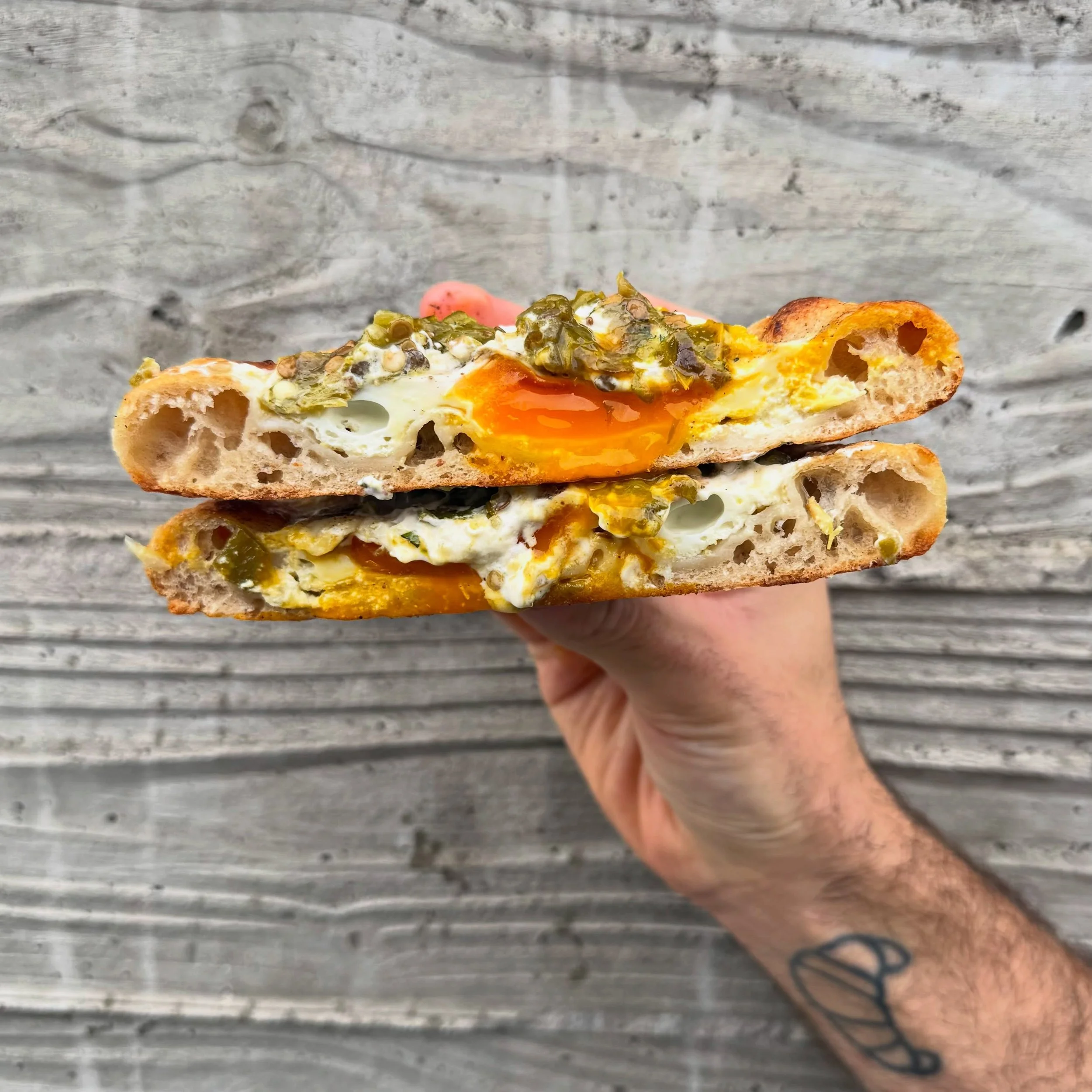 Shishito Turkish eggs! 

Labneh and yogurt mixed with an herby shatta made with all kinds of roasted peppers, topped with an egg, feta cheese, more shatta yogurt, and a big scoop of roasted shishito peppers and pistachio spread!!! What a diva 🧑&zwj;