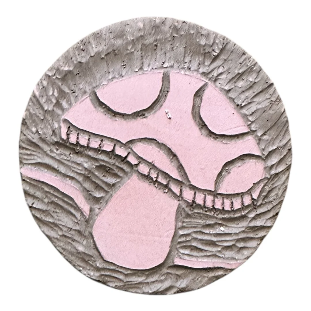 sgraffito mushroom on brown clay ceramics sample tile