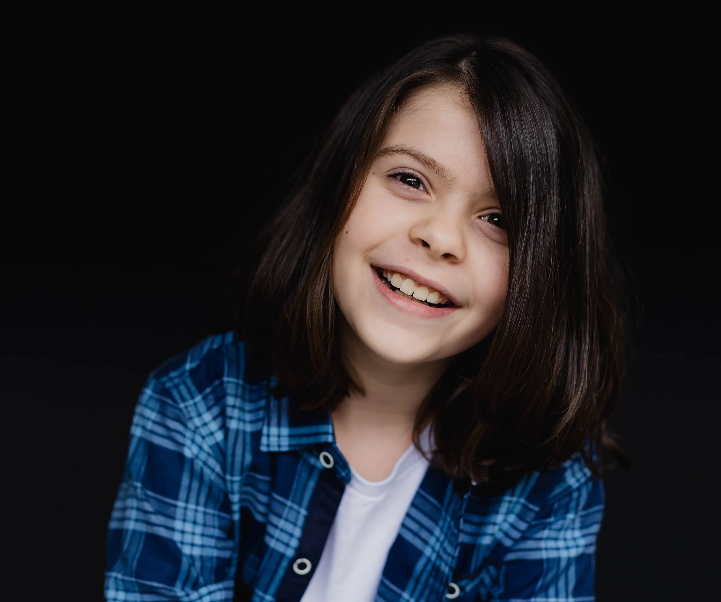 young boy smiles for homeschool picture day.