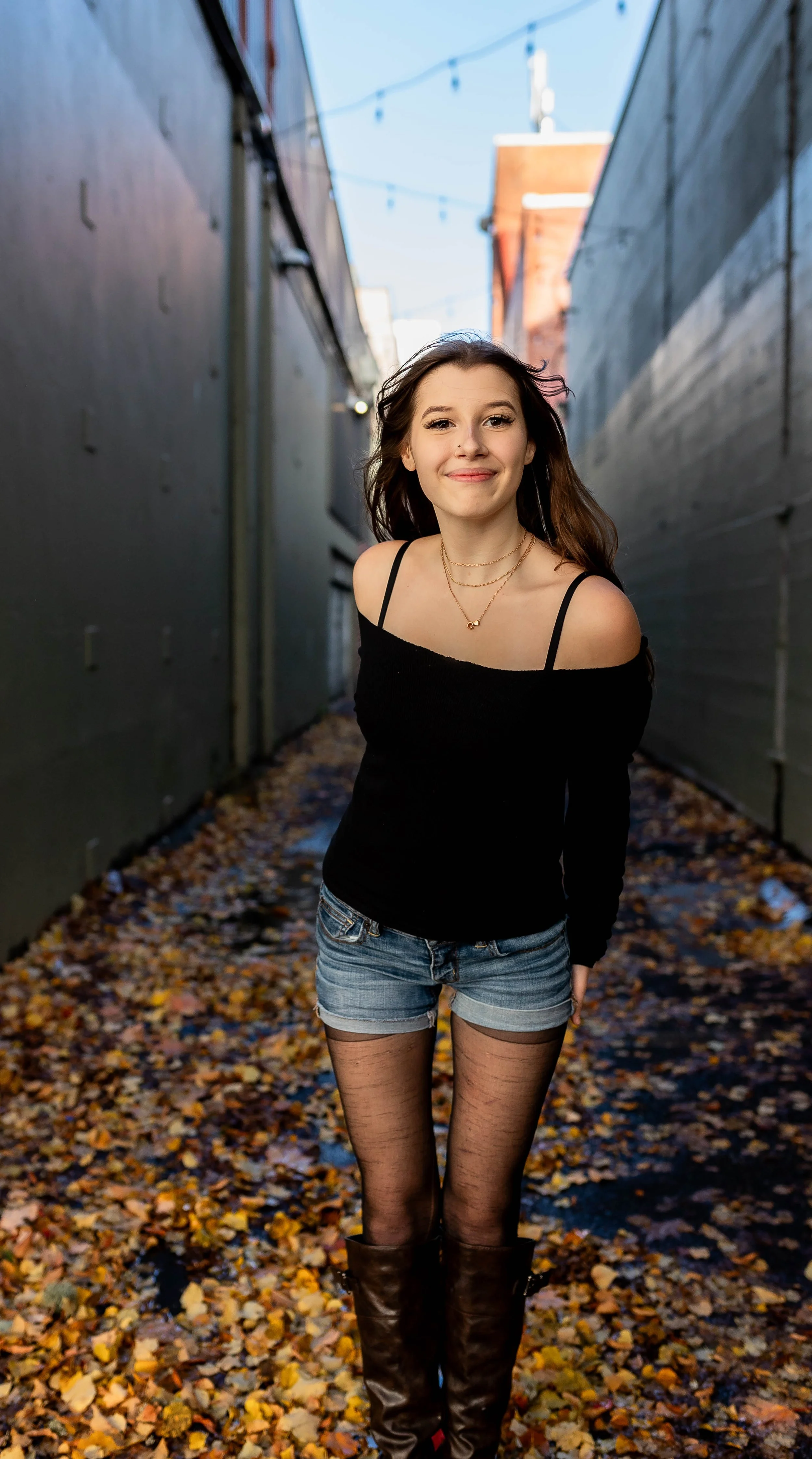 Downtown Olympia senior girl posing in an alley full of murals.