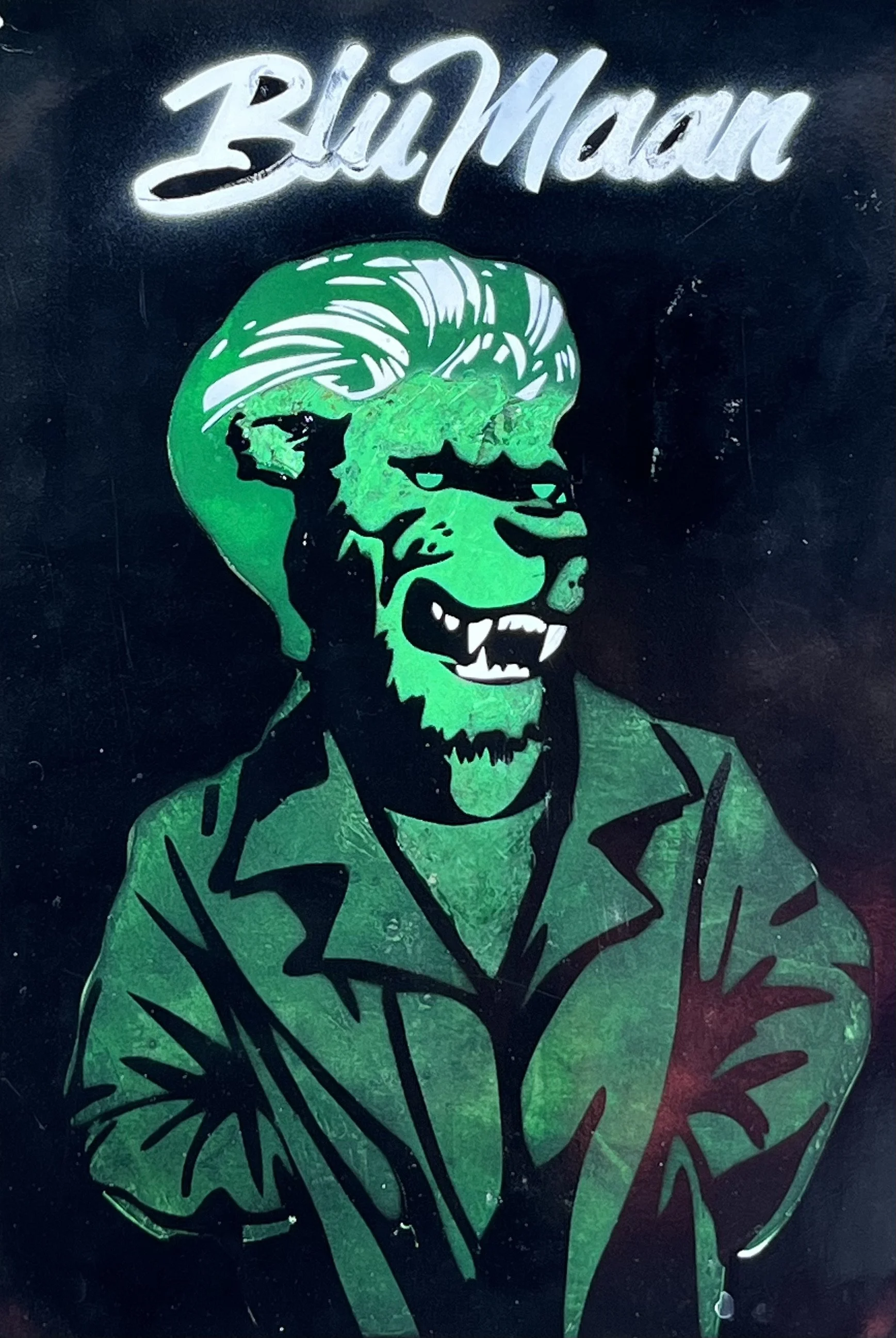Illustration of a green werewolf wearing a jacket with the text "BluMaan" above.