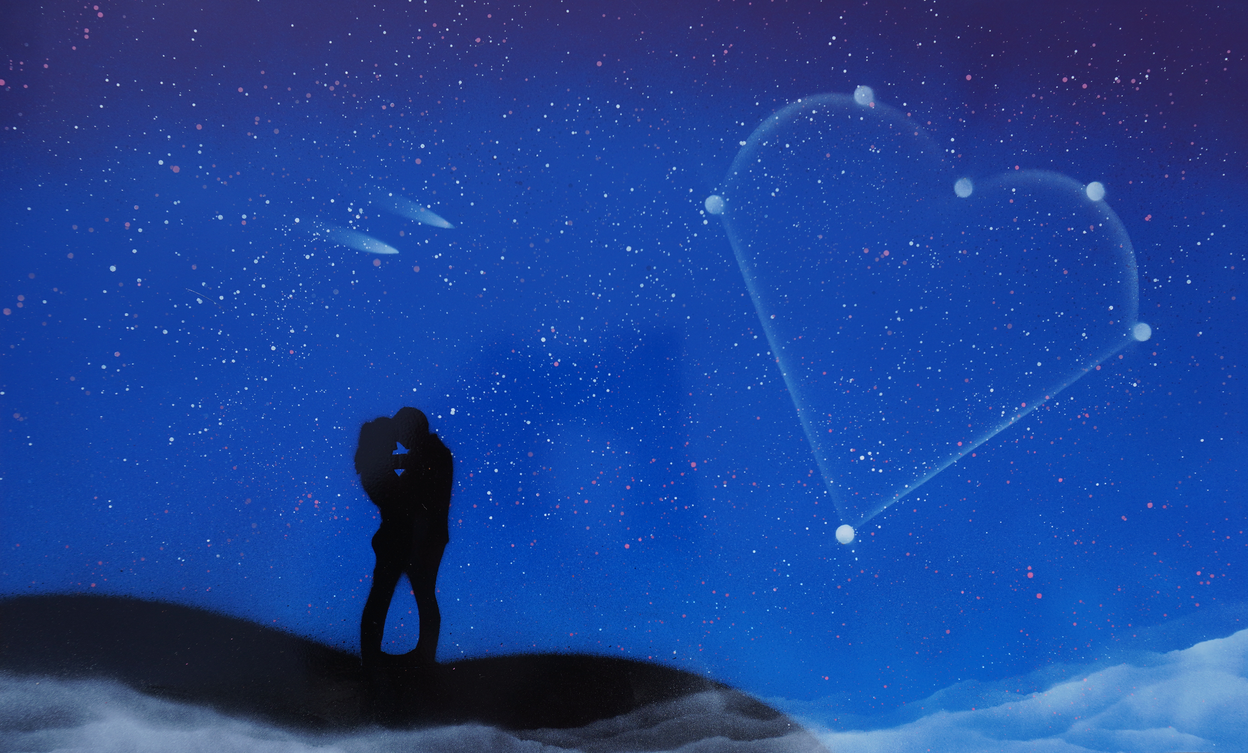 Silhouette of a couple kissing under a starlit sky with a heart-shaped constellation.