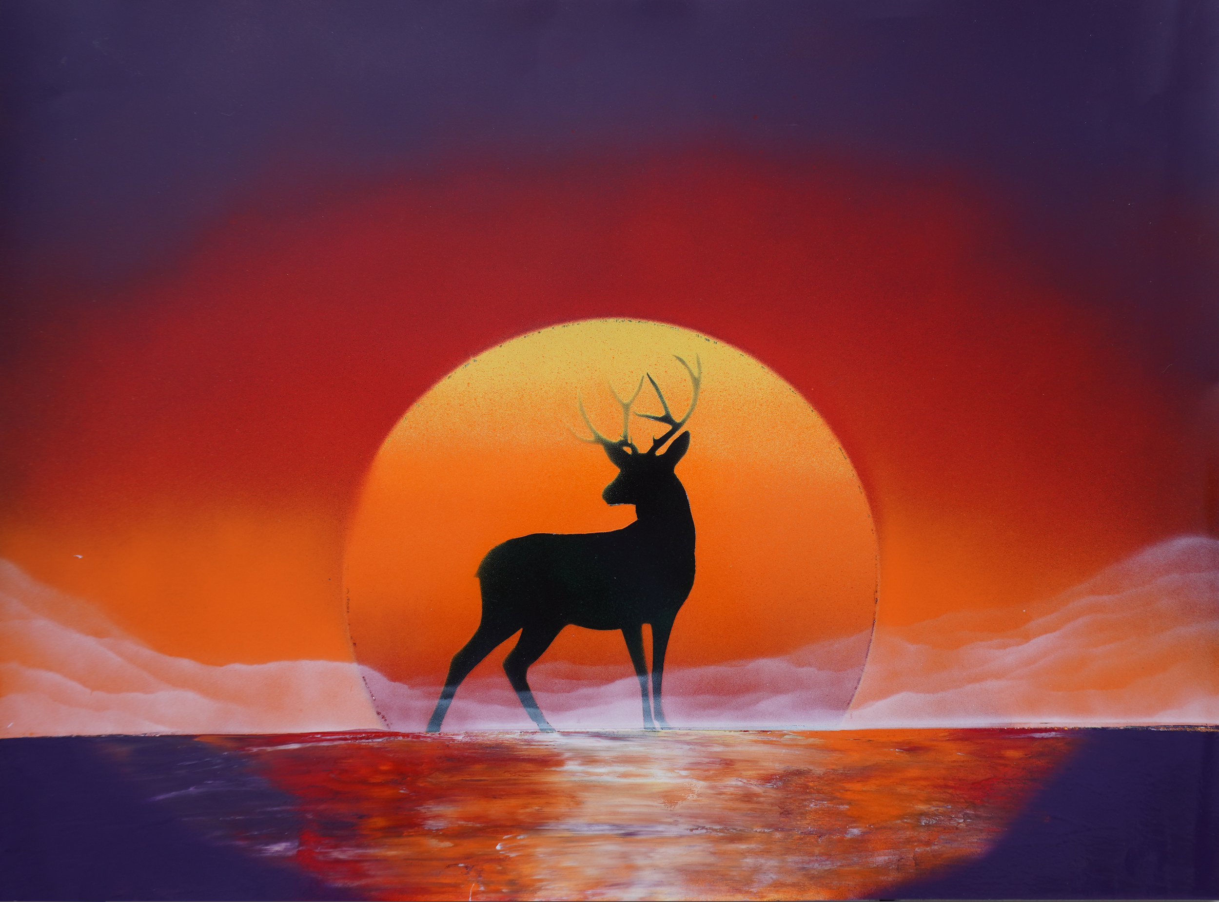 Silhouette of a stag against a large setting sun, with a vibrant purple and orange sky and reflective water below.