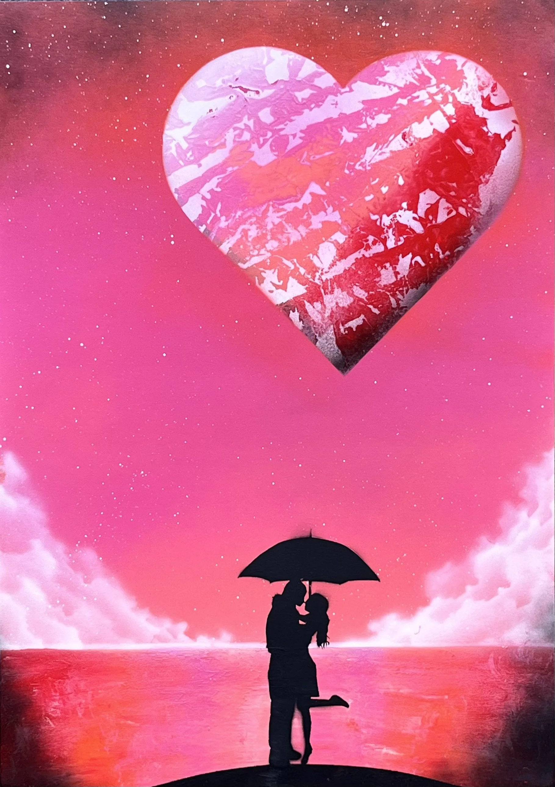 Silhouette of a couple with an umbrella kissing under a large heart in a pink sky.