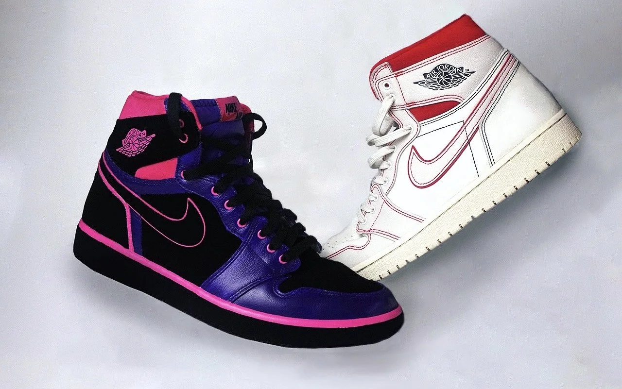 Two Nike Air Jordan sneakers in different colorways, one purple and black with pink accents, and the other white and red, against a white background.