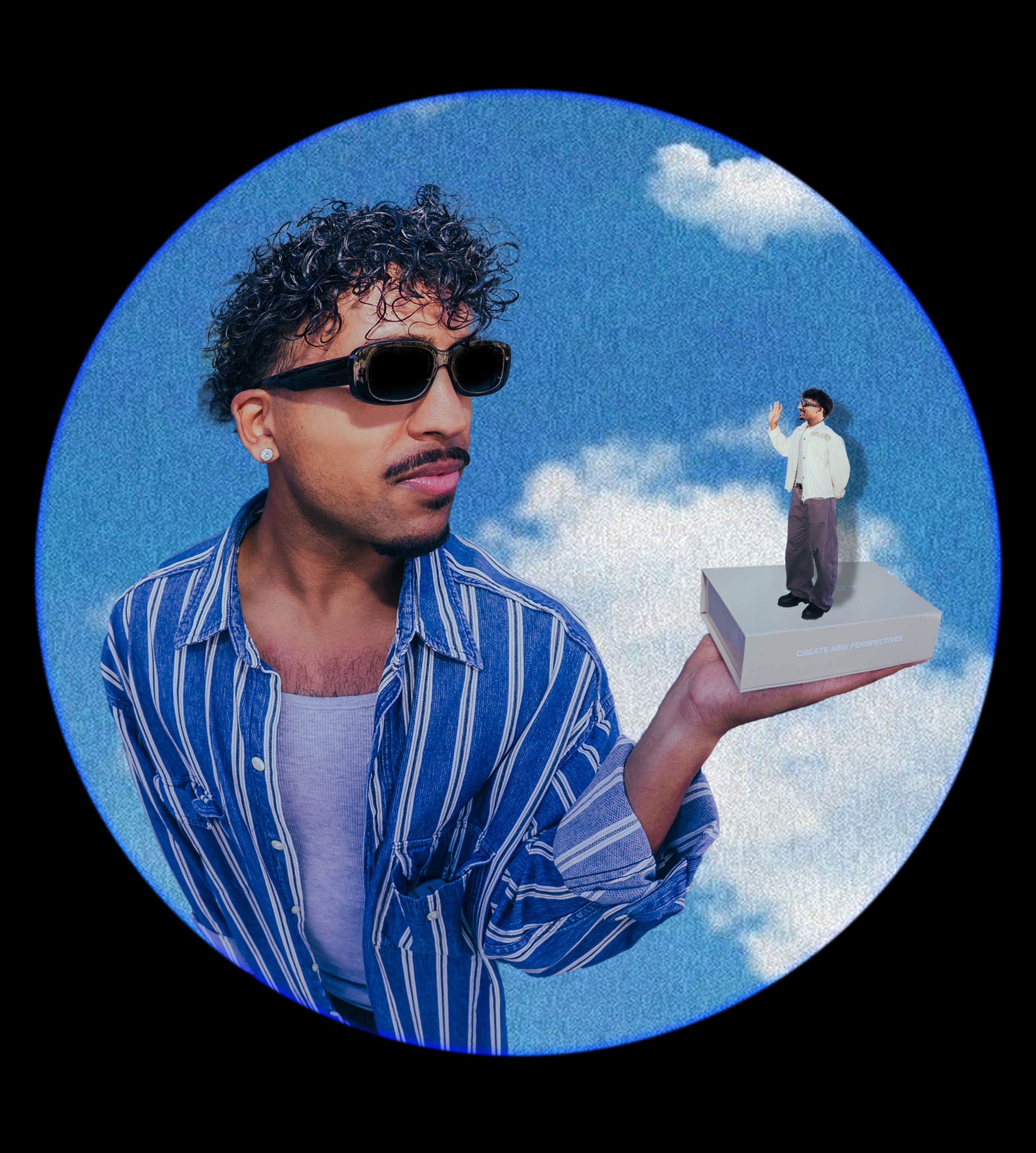 A large model of a man's face with curly hair, sunglasses, and an earring held in a hand. In the background, a smaller man in a white jacket is standing on a platform with a white box that has the words "CREATE NEW PERSPECTIVES" on it, against a clou