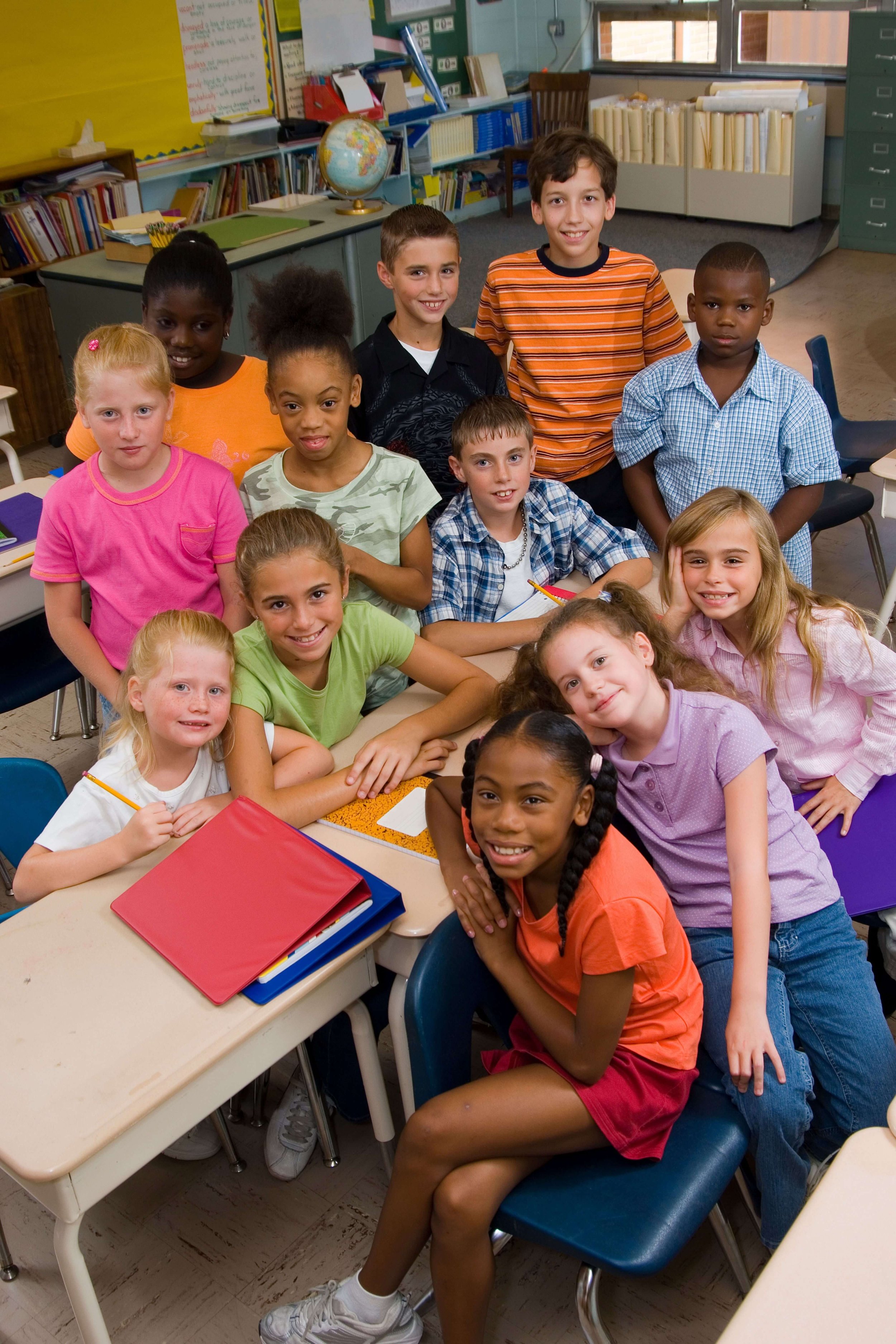 A group of kids posing for a picture.