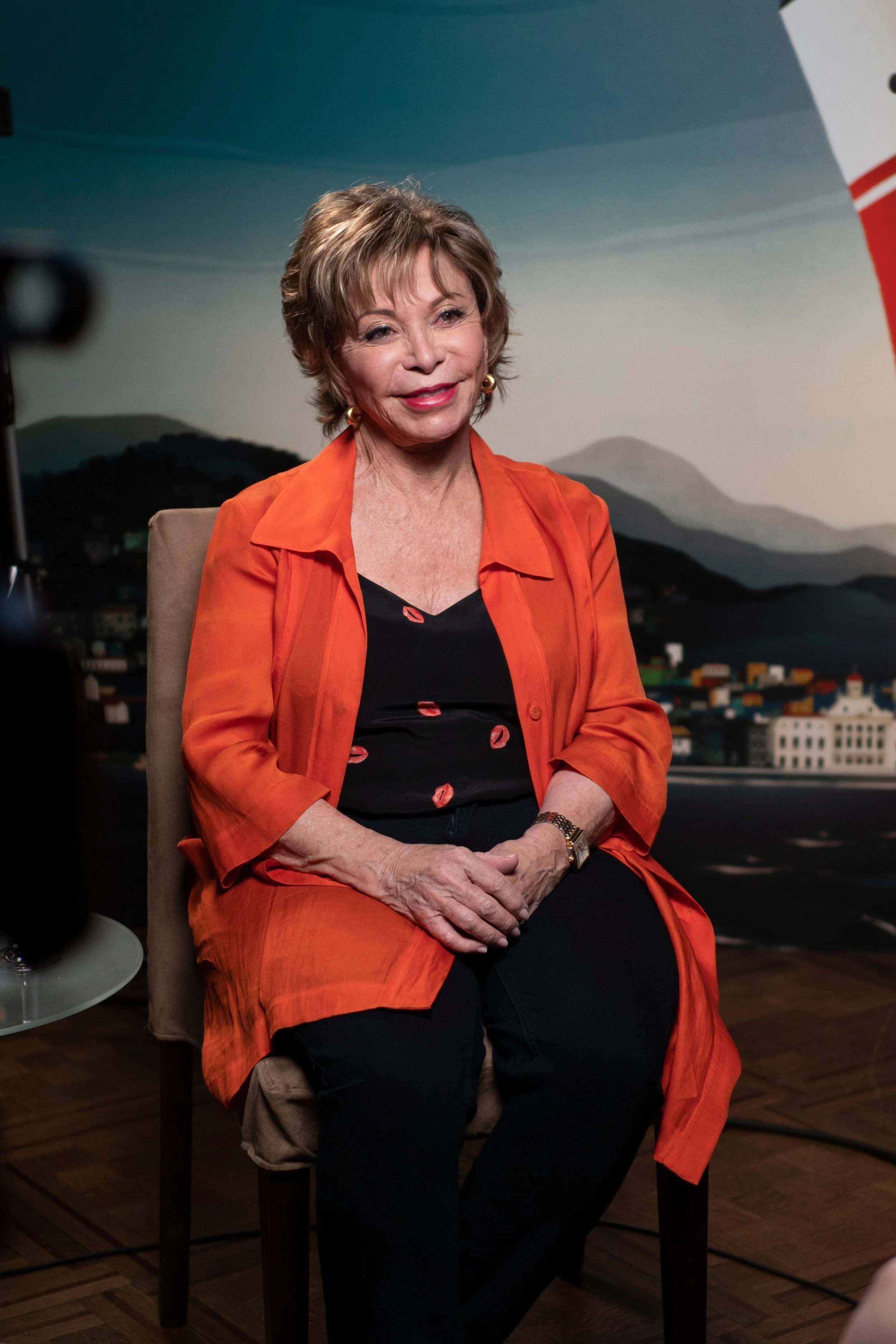 Isabel Allende sitting on chair