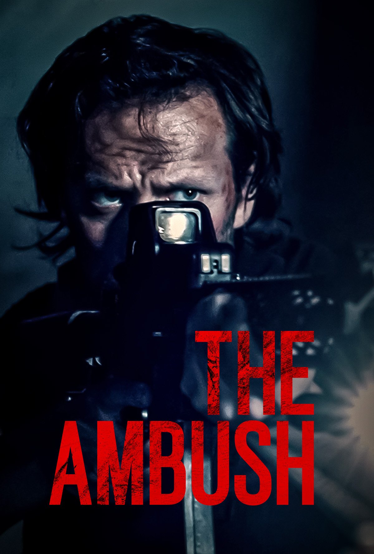 A man with disheveled hair aiming a gun directly at the camera, with the title 'The Ambush' in red text across the bottom.