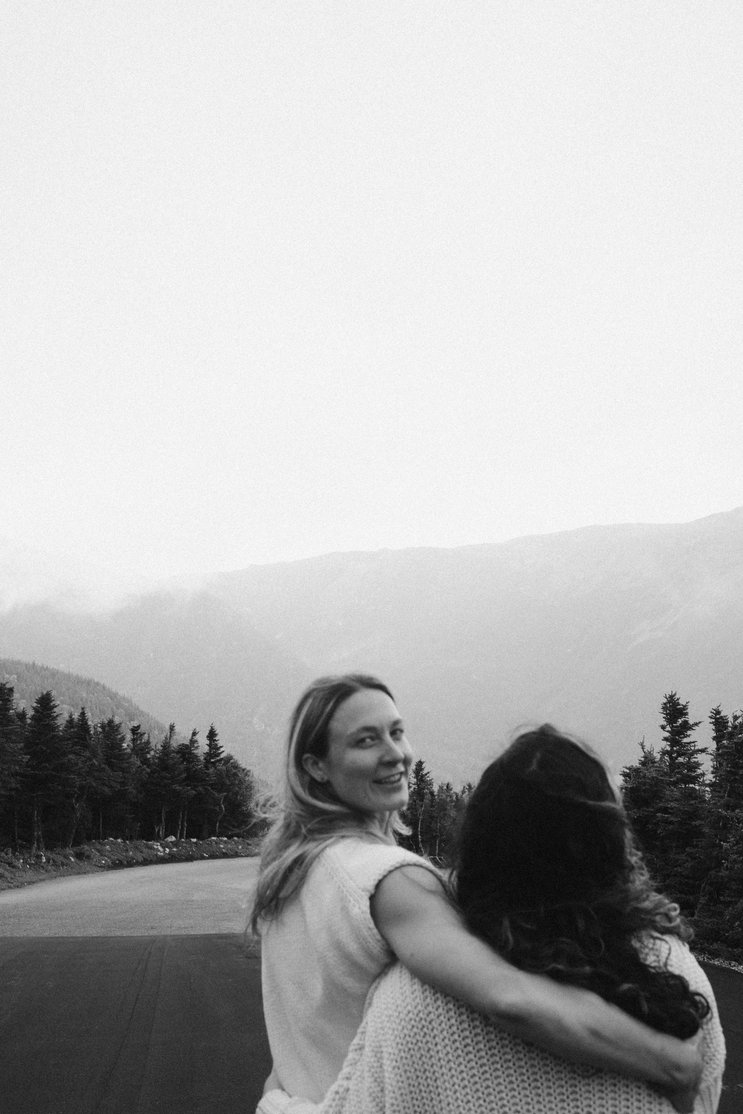 queer elopement wlw vermont photographer wedding Mount Washington landscape engagement photos lesbian couple in the White Mountains queer mountain engagement session foggy New Hampshire mountains adventure couples photography scenic engagement photos