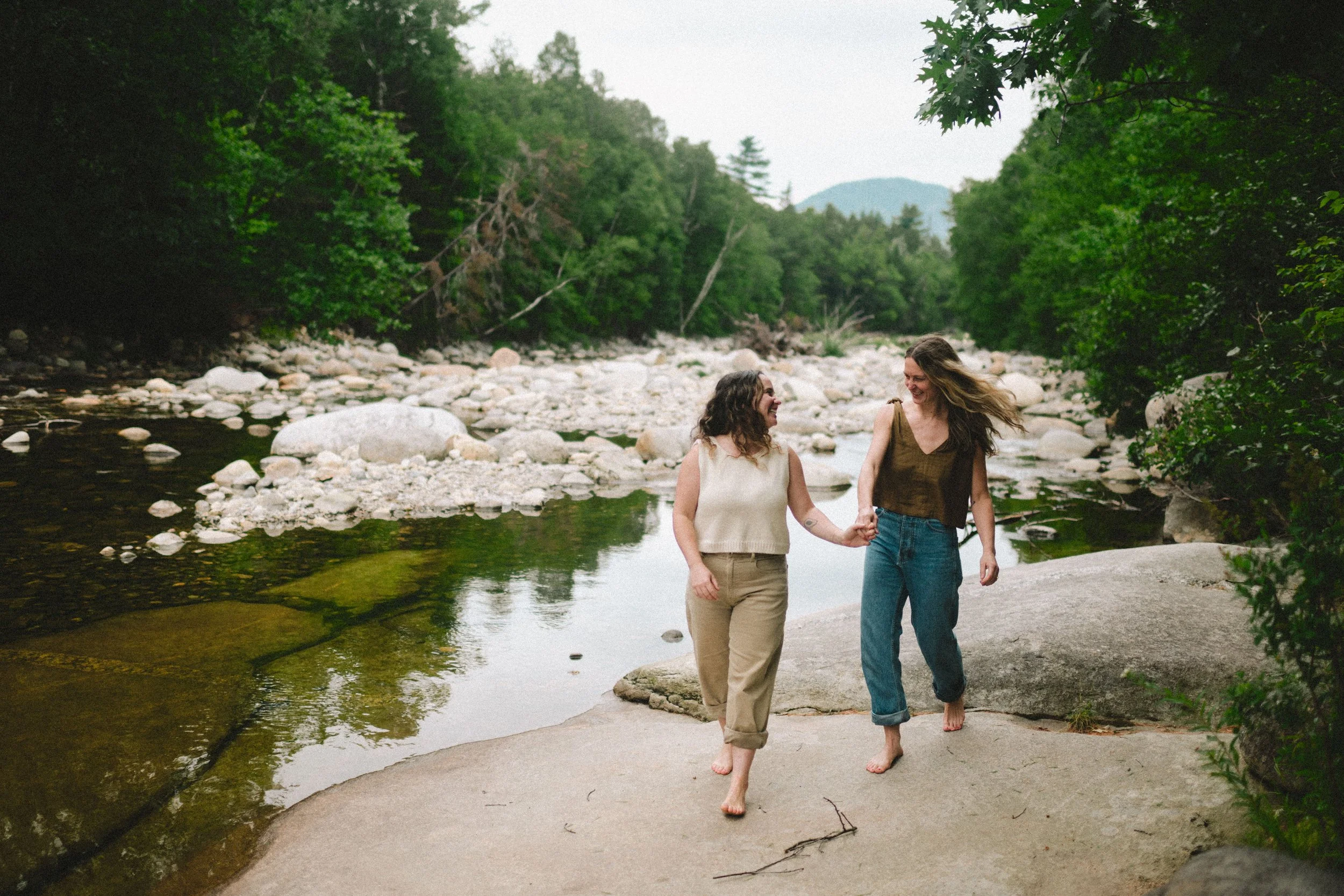 New Hampshire river engagement photos White Mountains river photos lesbian couple by the river outdoor queer engagement session documentary couples photography scenic New Hampshire engagement photos wlw elopement engagement wedding