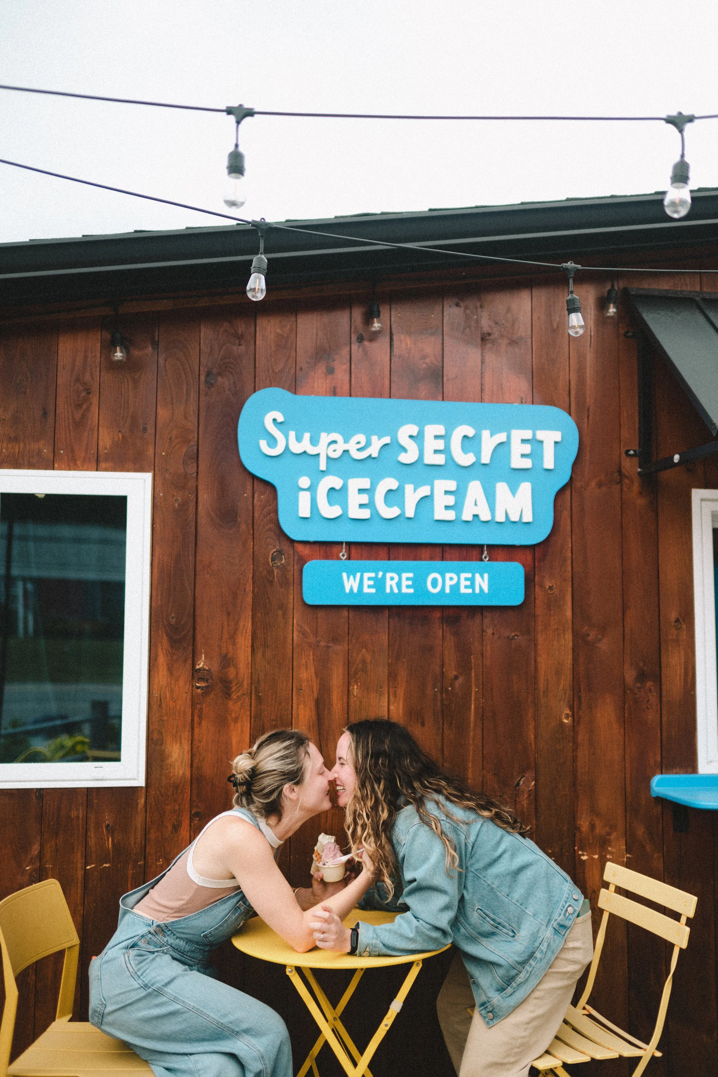 wlw queer engagement photos pick your fave activity for your photos queelesbian couple ice cream date queer engagement session Super Secret Ice Cream Gorham New Hampshire couples photography candid date night photos documentary engagement photography