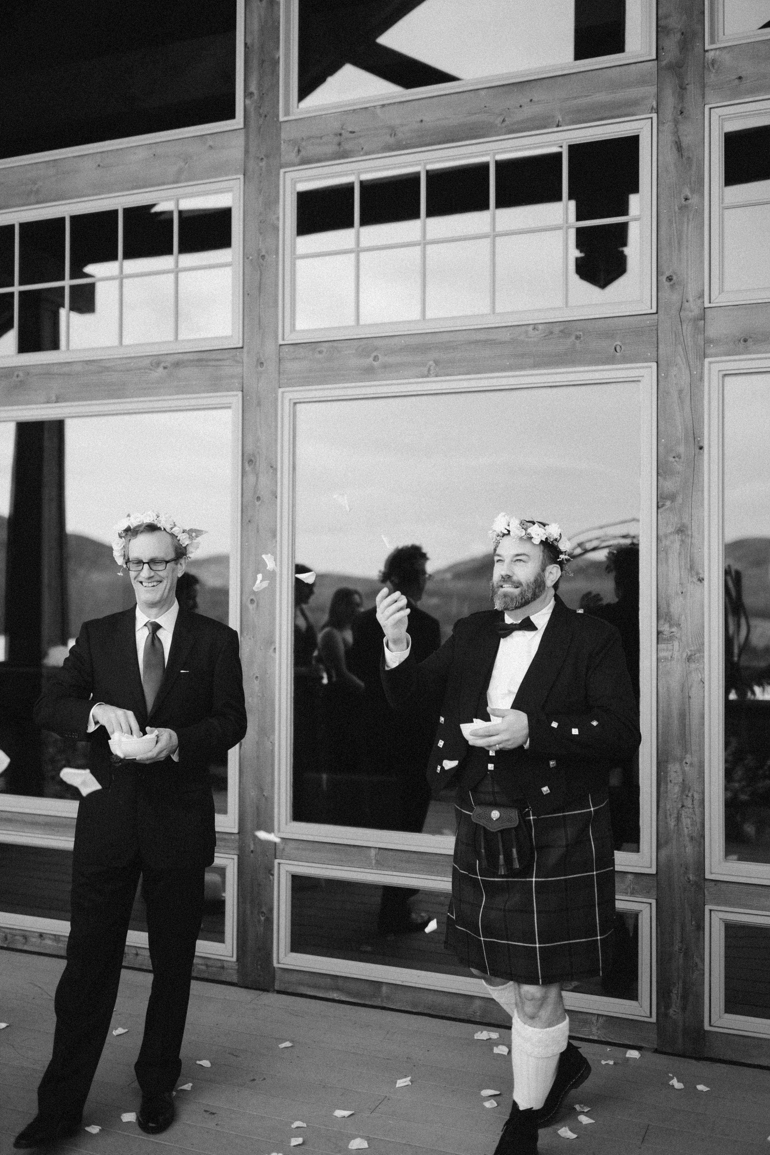 flower girl dads close friends and family watching a small outdoor winter wedding ceremony at Mountain Top Resort