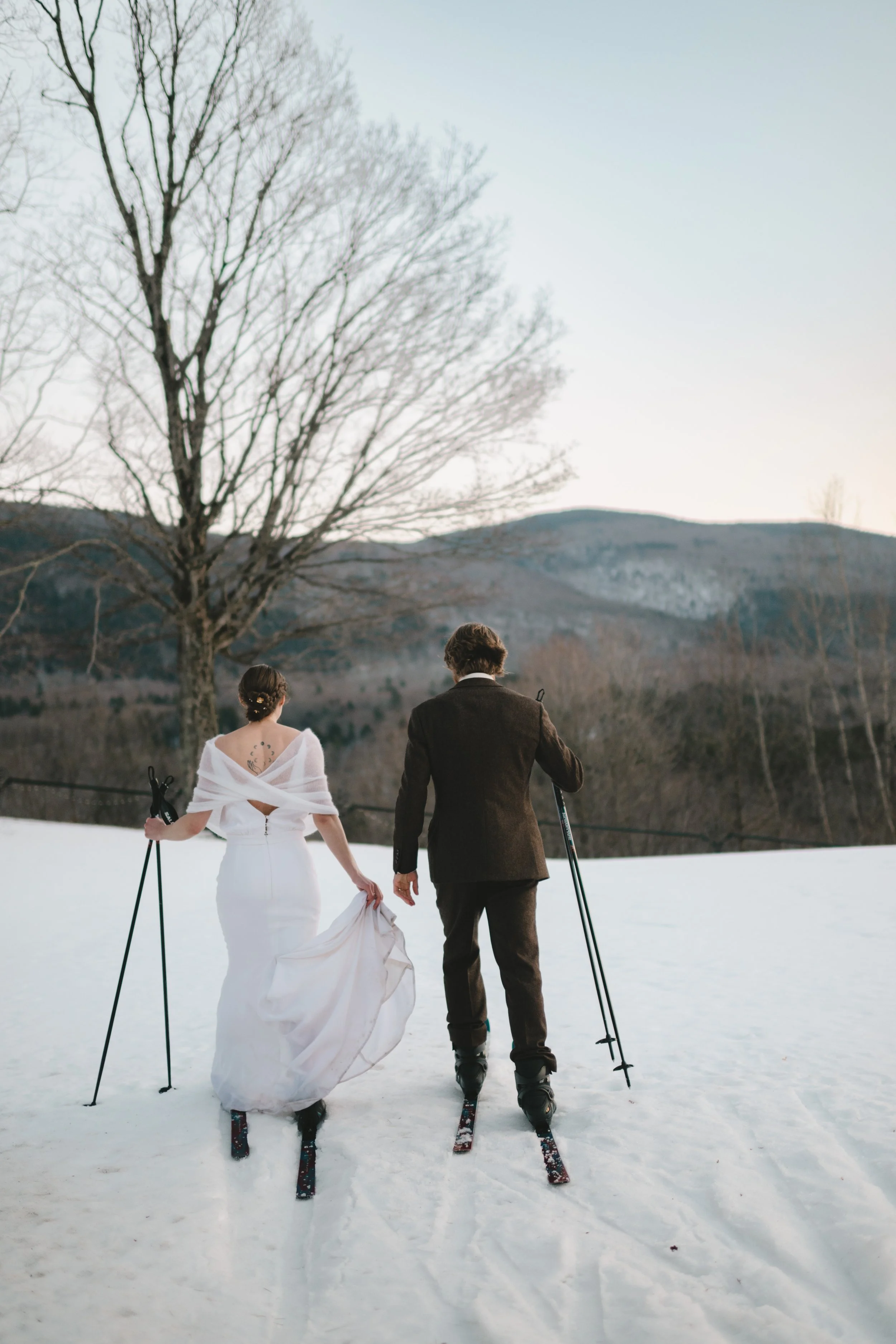winter wedding portraits in snow at Wilburton Inn Manchester Vermont  couple sunset portraits during snowy Vermont winter wedding  romantic winter wedding portraits at Wilburton Inn estate