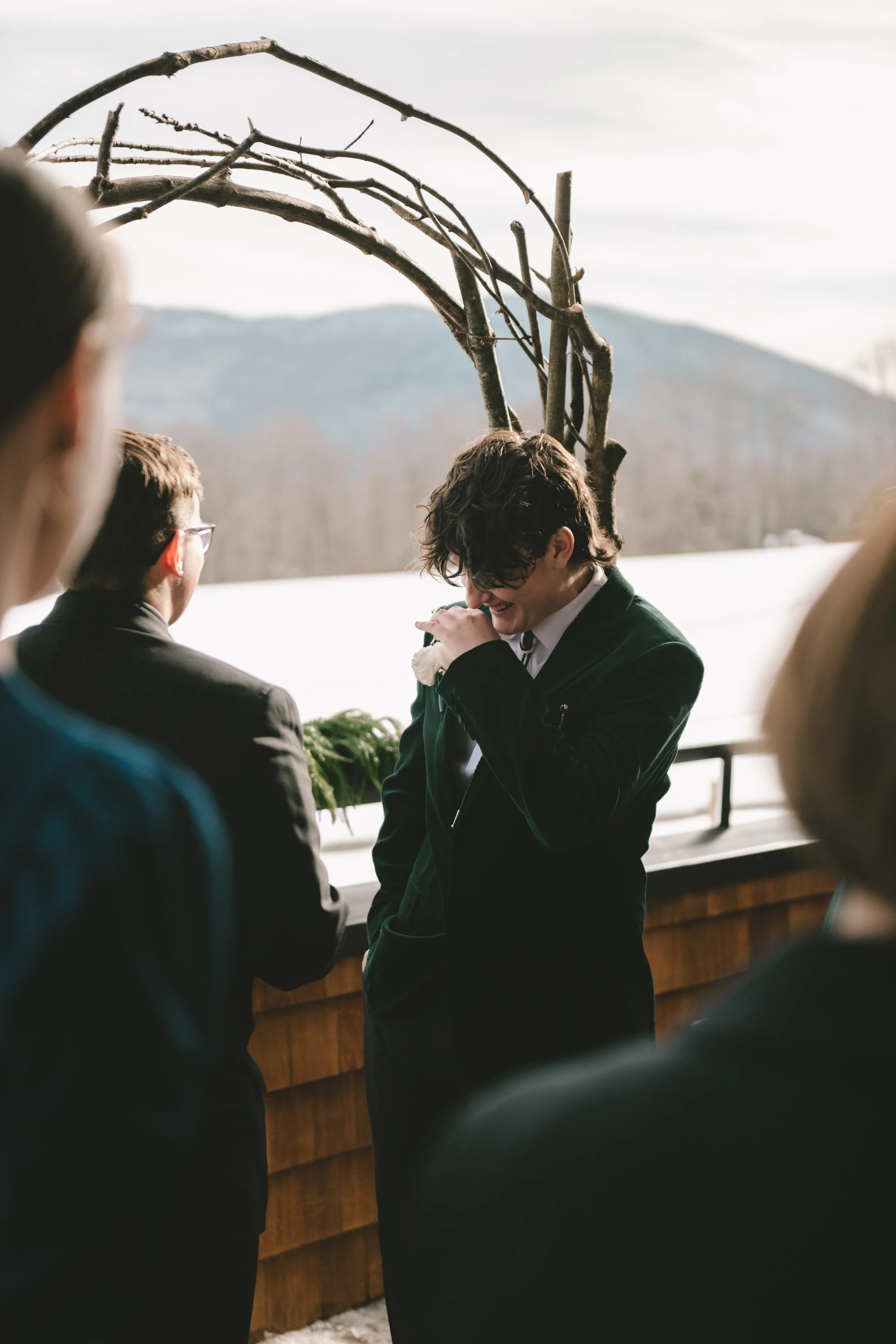 documentary wedding photo of couple exchanging vows during intimate winter wedding in Chittenden Vermont