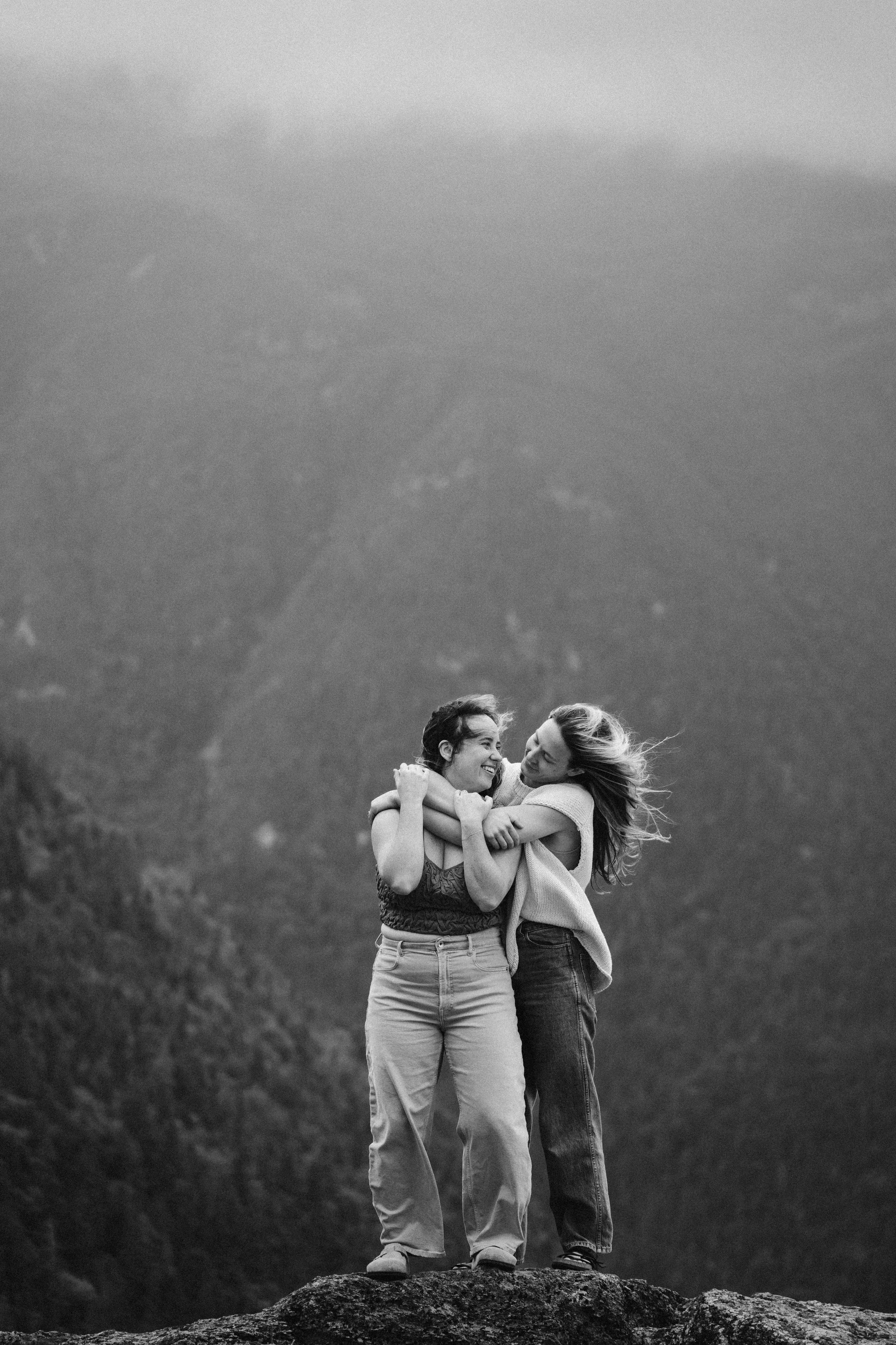 Mount Washington landscape engagement photos lesbian couple in the White Mountains queer mountain engagement session foggy New Hampshire mountains adventure couples photography scenic engagement photos wlw queer vermont photographer