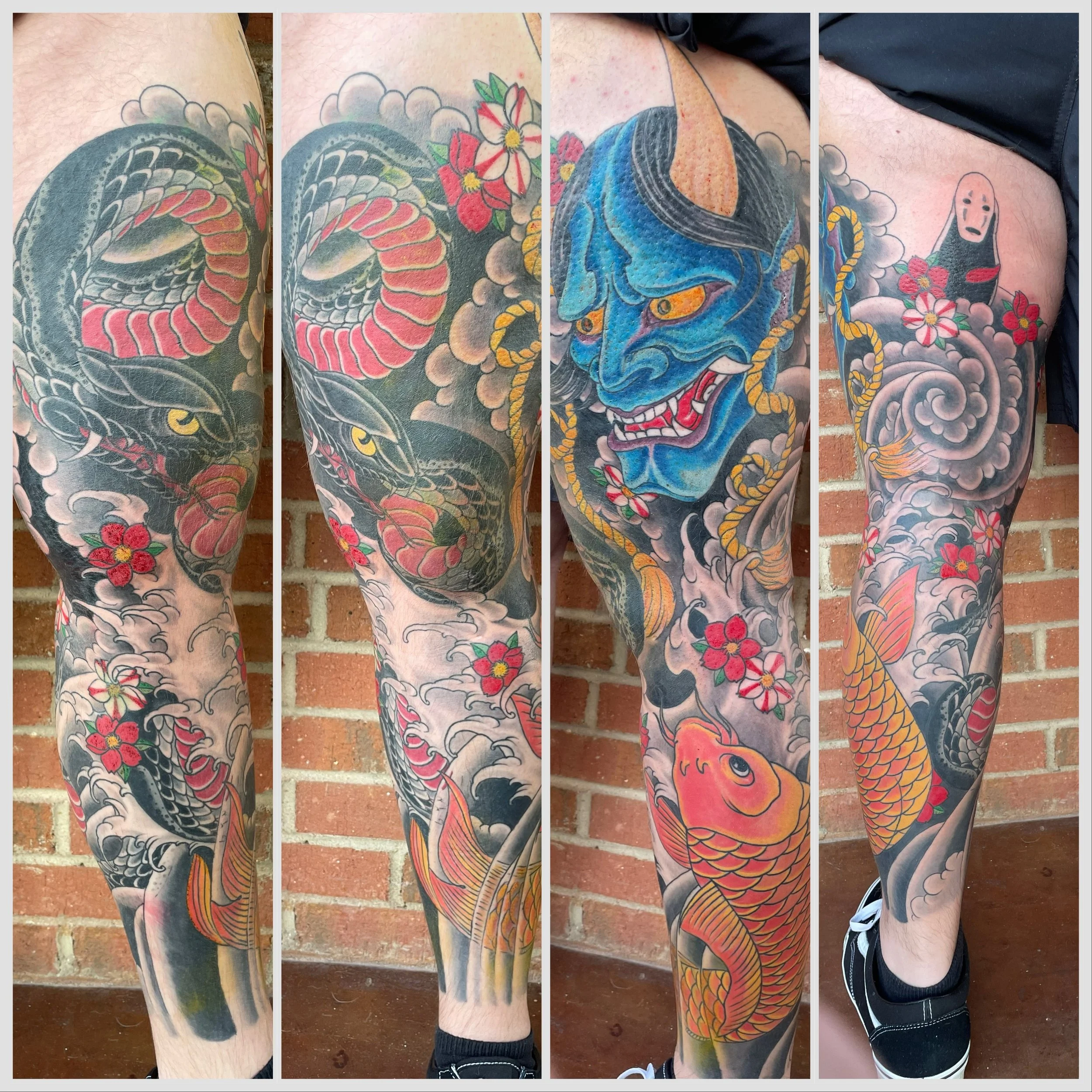 Close-up of colorful Japanese style tattoos on person's leg featuring a snake, flowers, a blue hannya, clouds, and a koi fish.
