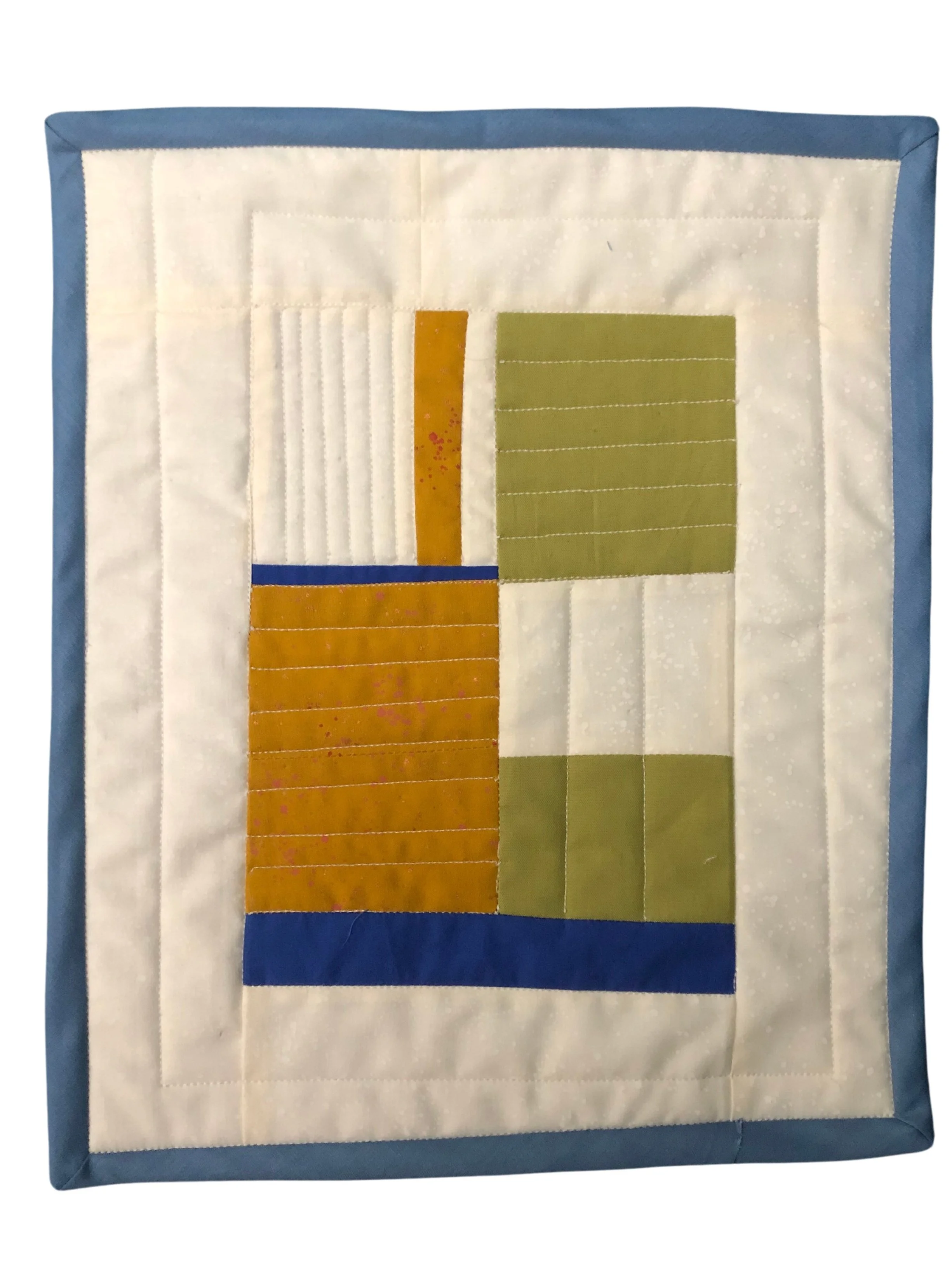 small white quilted wall hanging with orange, green, and blue rectangles