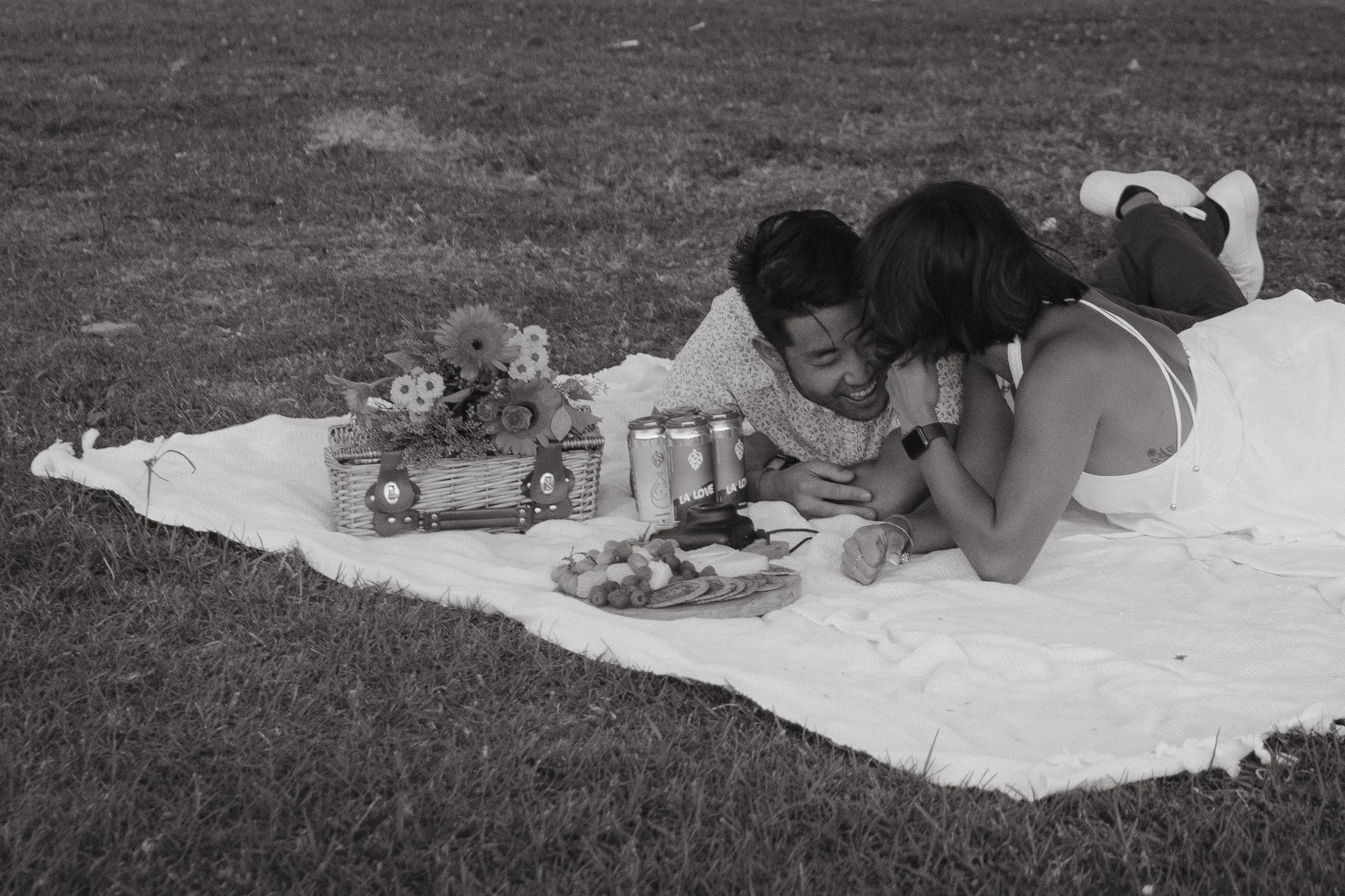 Couple celebrating engagement with picnic photos in Los Angeles - Erika Aoki Photography