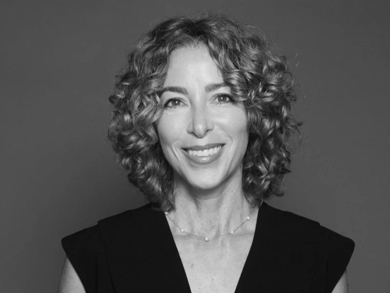 Black and white portrait of a smiling woman with curly hair. Another member of our medical advisory board who supports Seen's calcium chew and recommends our calcium chew to her patients.
