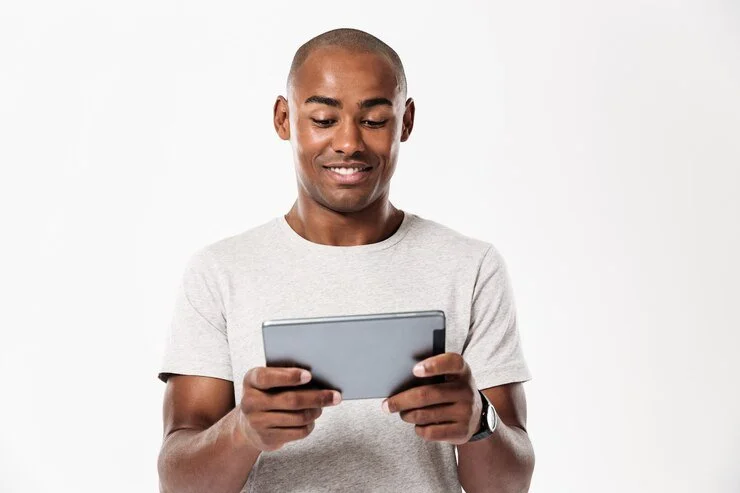 smiling-african-man-using-tablet-computer_171337-9680.jpg