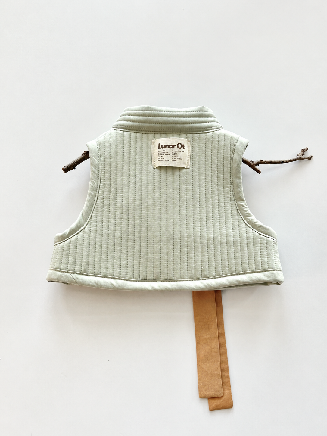 Mint Quilted Vest with Twig Hanger.png