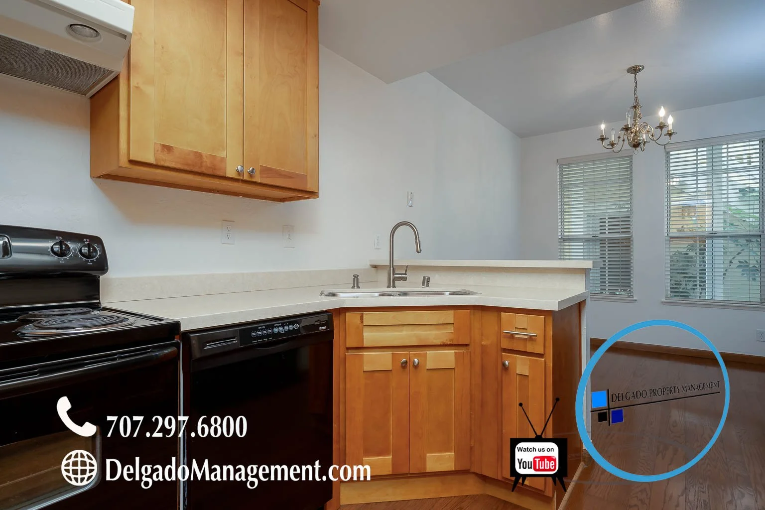 Kitchen area with wooden cabinets, black stove, and dishwasher, with a sink and window in the background. Overlay text includes contact info and website for Delgado Property Management, and a YouTube logo.