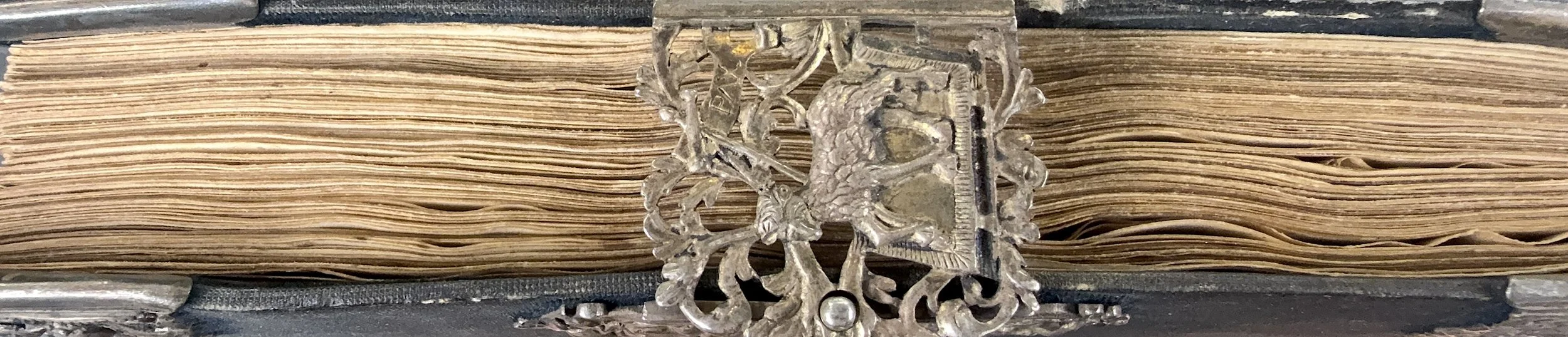 Detail of the eighteenth-century black velvet binding with silver corner-pieces and clasp