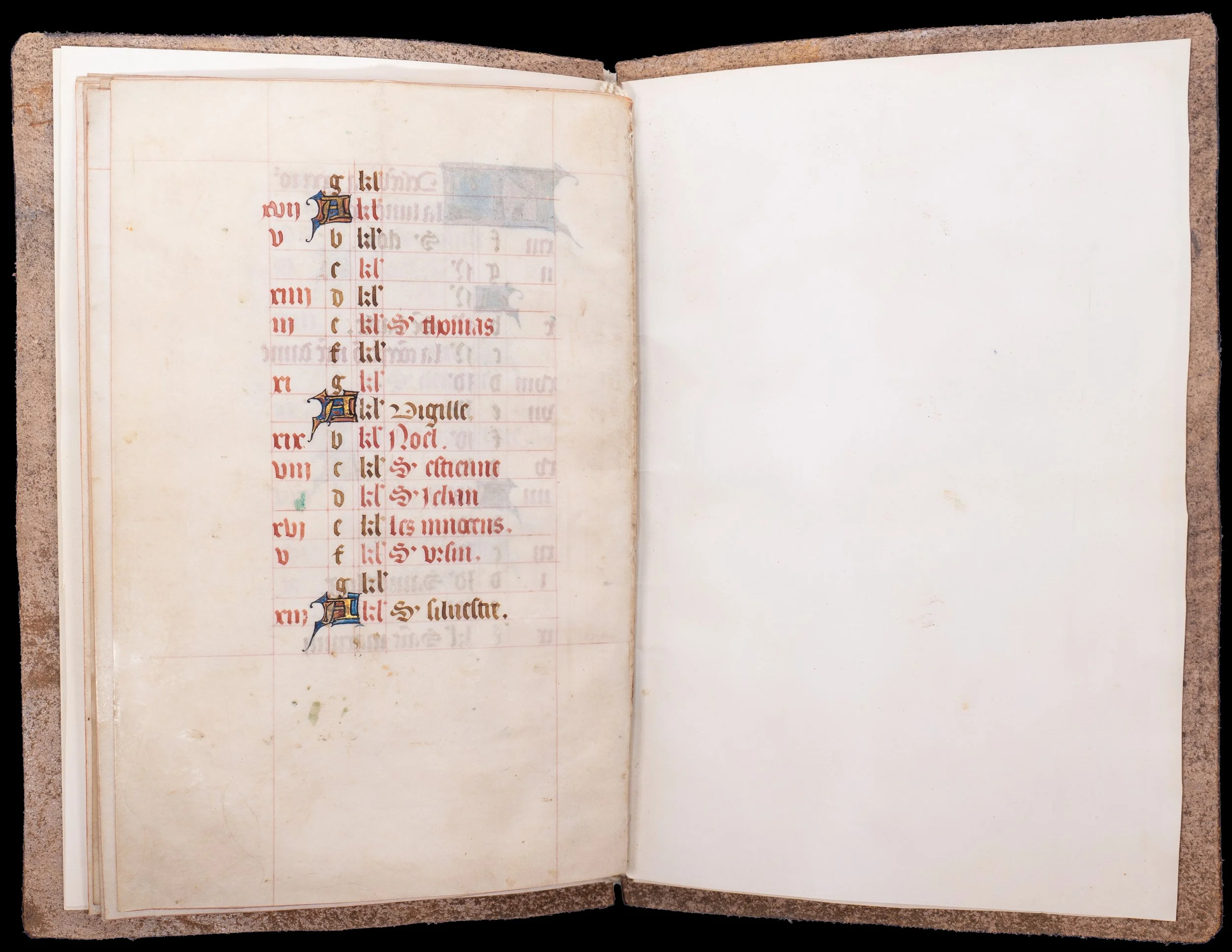 December page from a fifteenth-century French Book of Hours calendar with Saint Ursinus of Bourges rubricated in red.