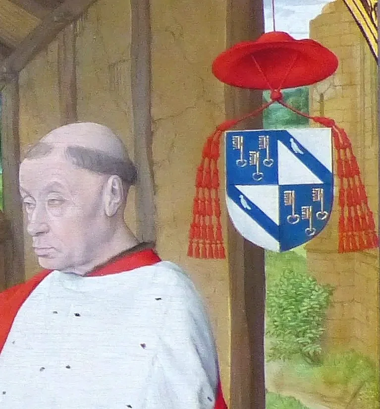 Jean Hey (Master of Moulins), detail of the Nativity with Cardinal Jean Rolin, c. 1480, showing Rolin kneeling in prayer beside his arms surmounted by the cardinal’s hat. Musée Rolin, Autun.