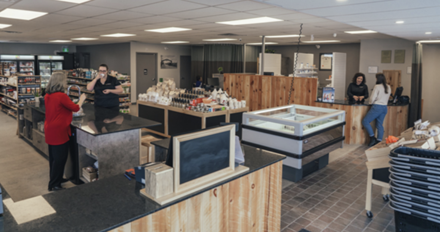 Interior of Seasons Pharmacy and Culinaria with staff and customers