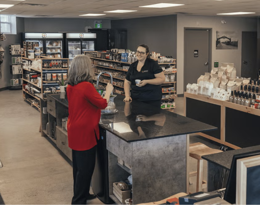 Customer at the counter inside Seasons Pharmacy