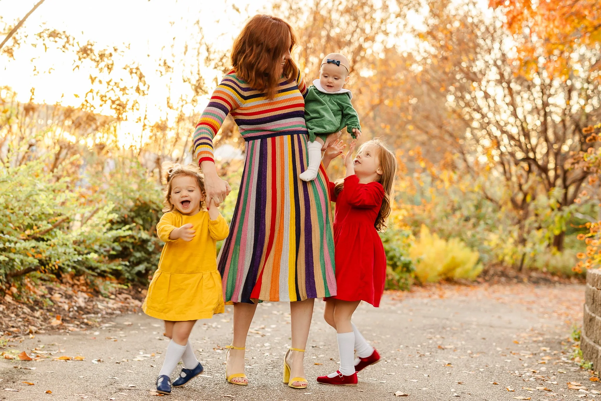 mom and children dancing during a family photography session using Natural Light by Caitlin Ross in Memphis Tennessee