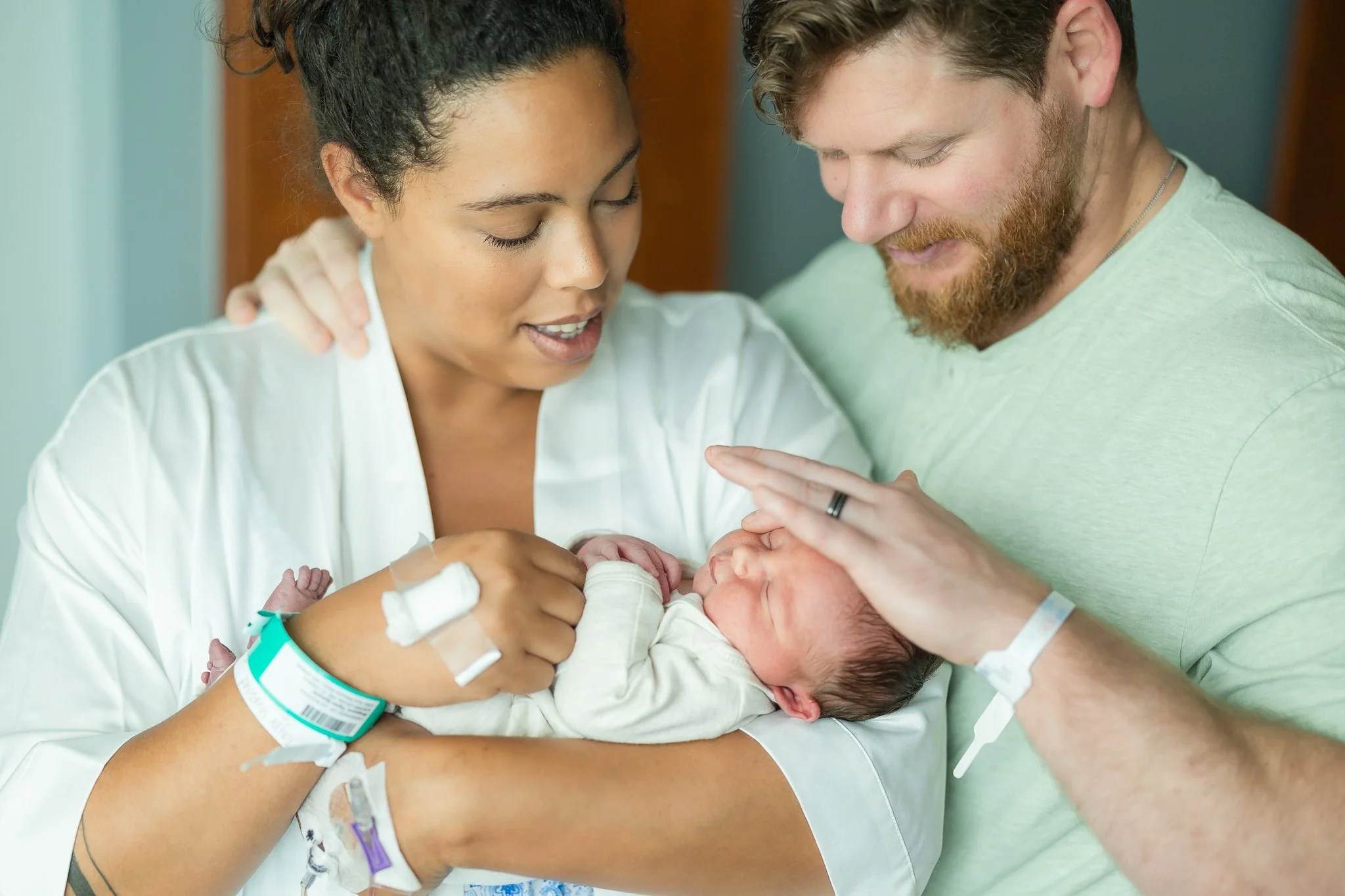 brand new mom and dad holding their newborrn son in memphis tn