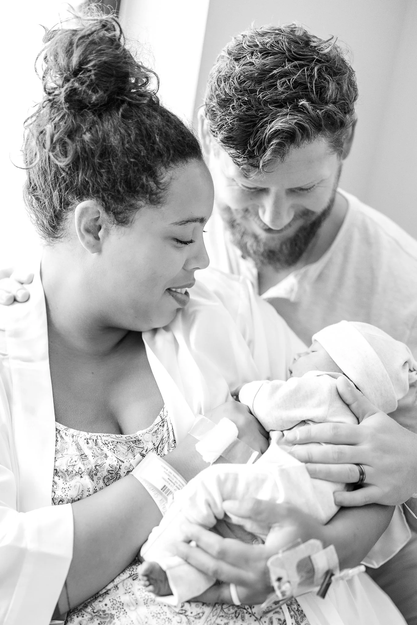 mom and dad admiring their newborn son right after birth in memphis