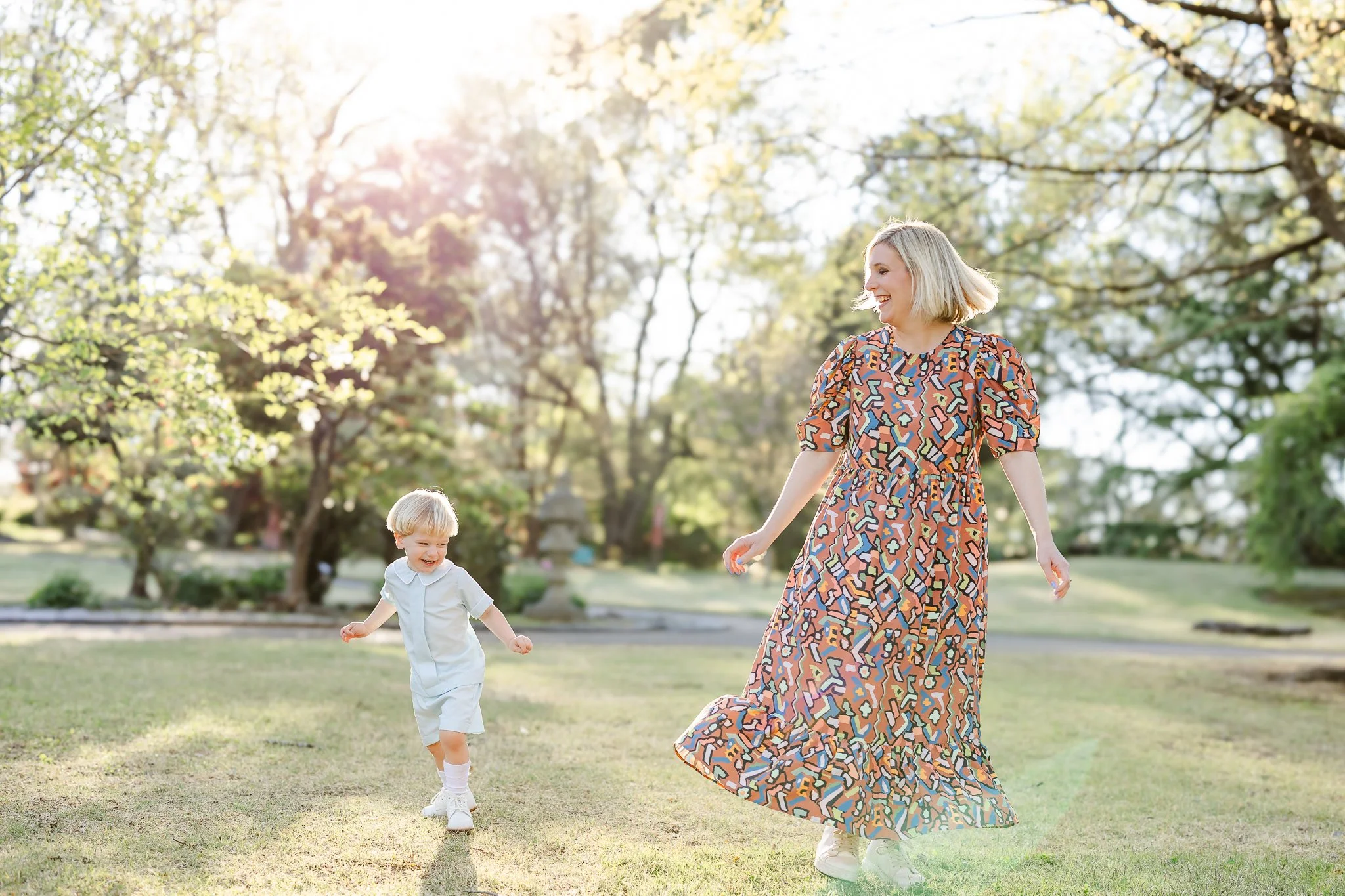 Mother and child playing in a sunny park