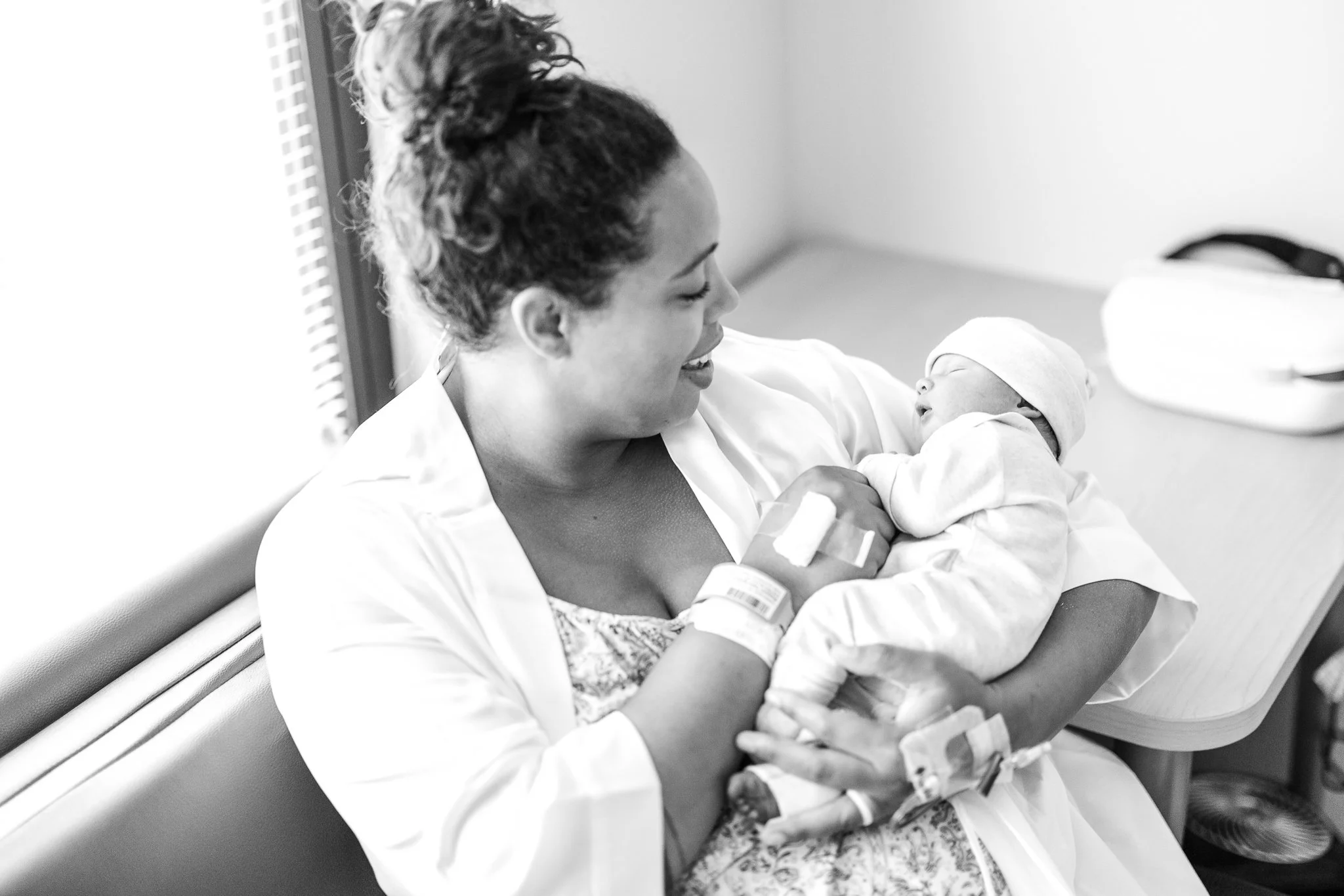 brand new mom holding her newborn son right after birth