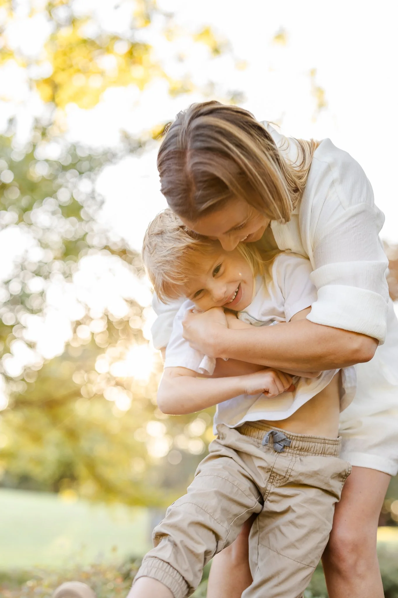 mother embracing son at golden hour Family Photography with Natural Light by Caitlin Ross in Memphis Tennessee