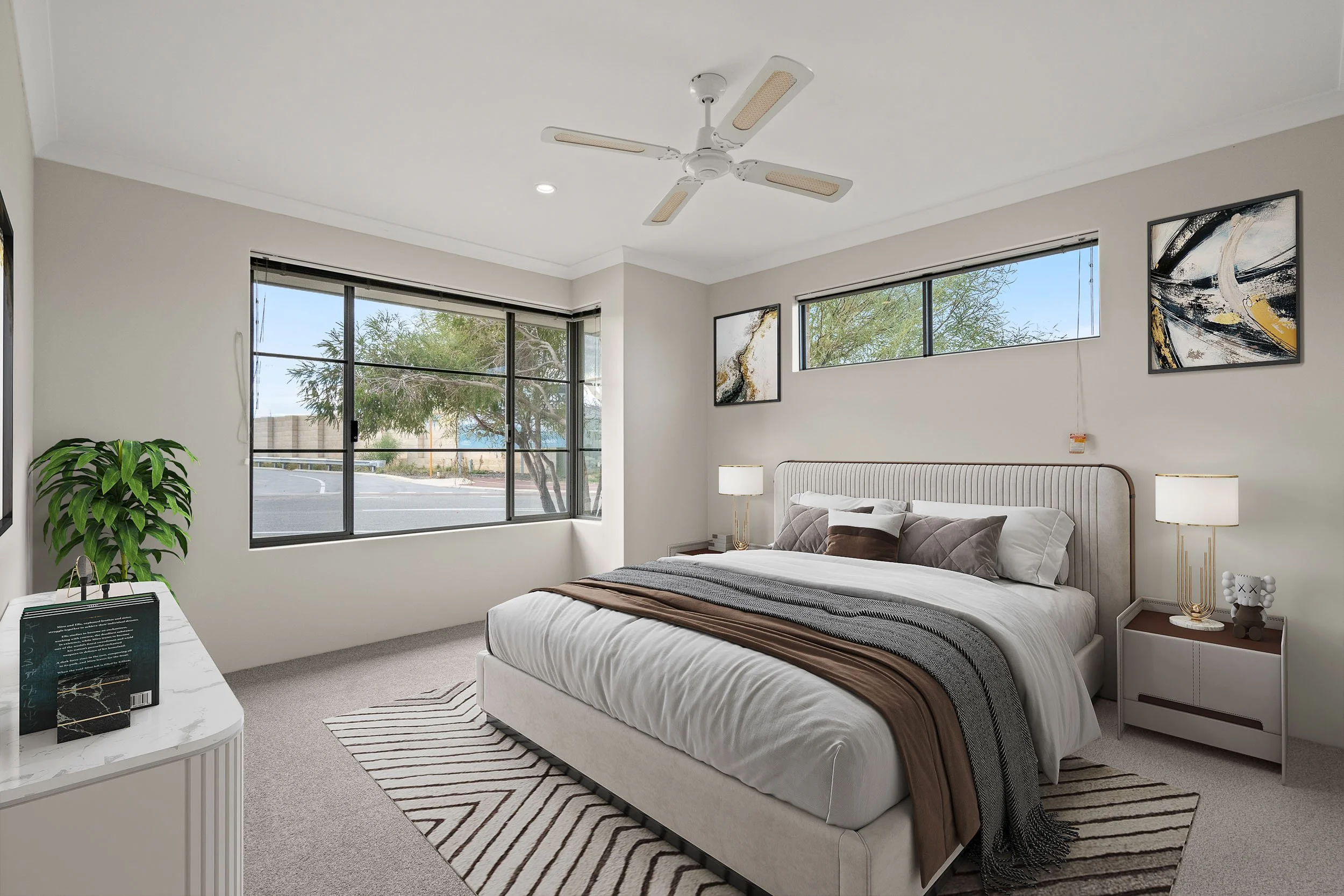 Virtually staged bedroom with neutral bedding, a ceiling fan and broad windows.