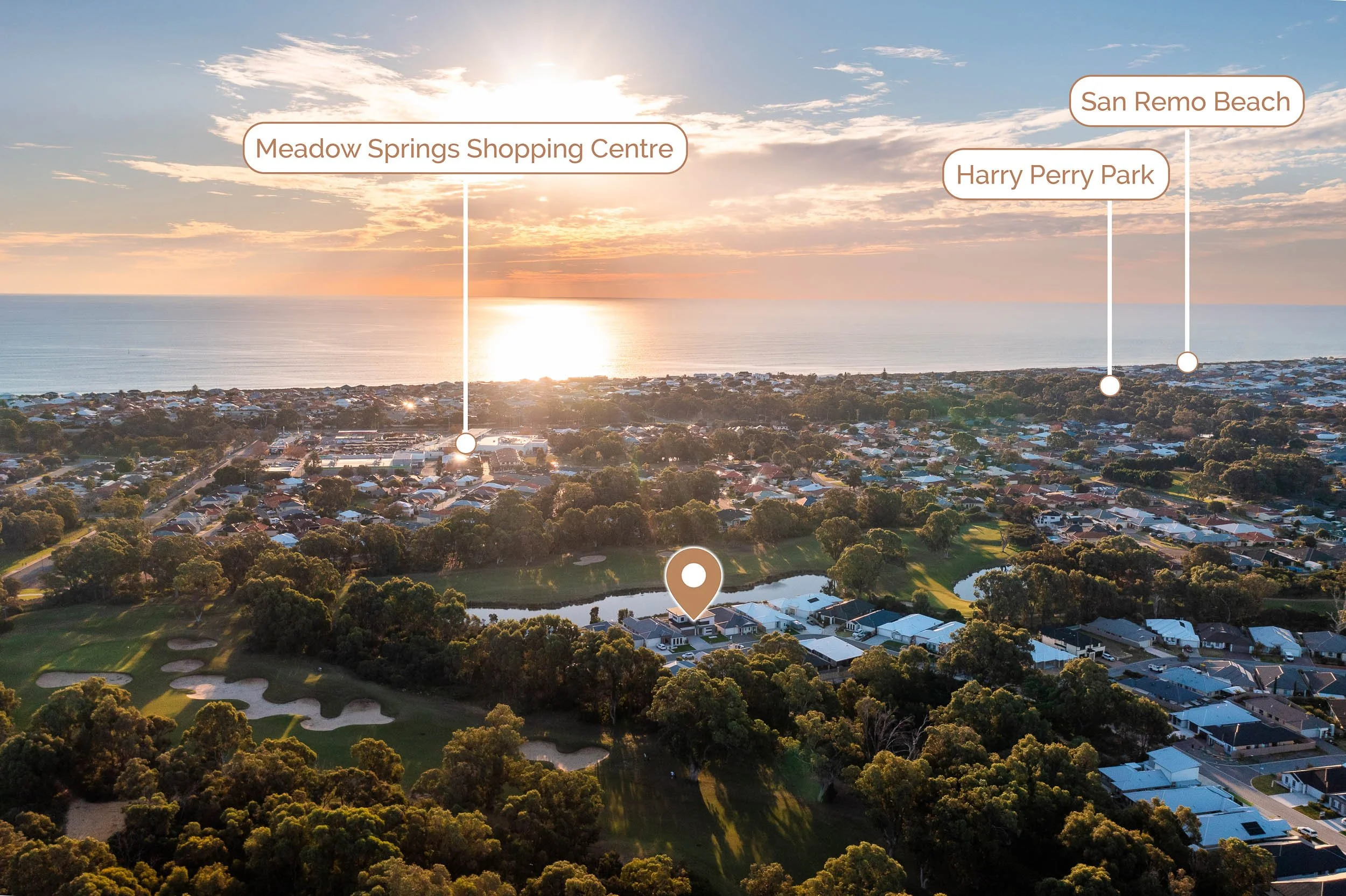 Sunset aerial view across a leafy neighbourhood and waterways with location labels.