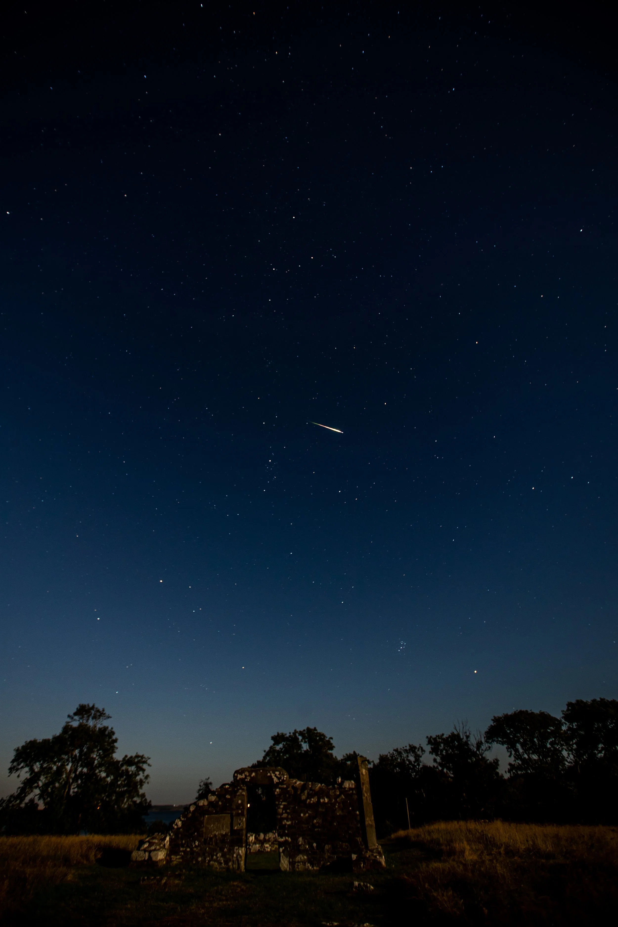 A Meteor lights up as it enters the Earth's atmosphere. Taken at Nendrum Monastic Site. Mahee Island, Comber, Newtownards BT23 6EP