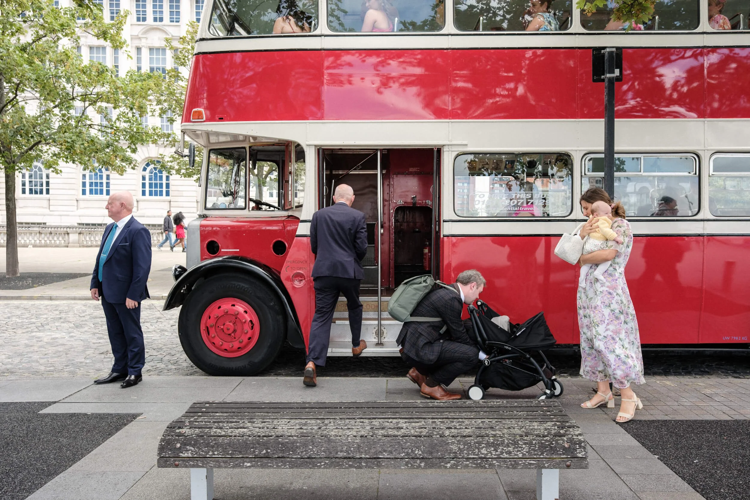 Guests arrive at a Liverpool reception via a red double decker bus.