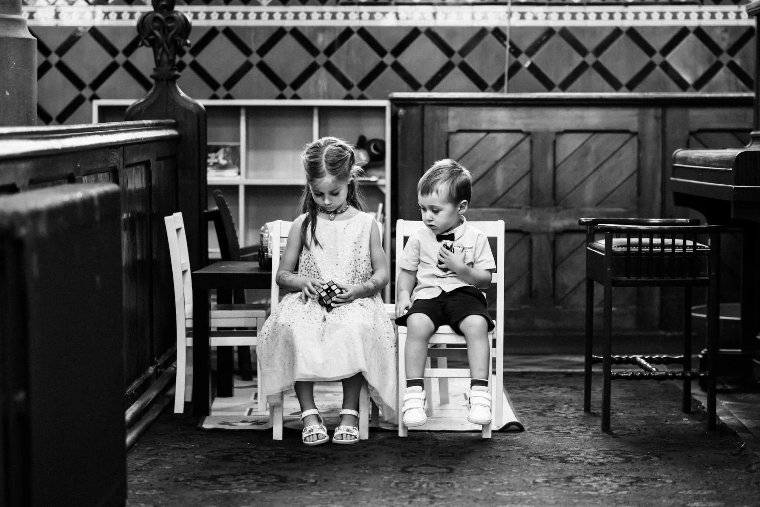 Children play with a rubik's cube in the ceremony