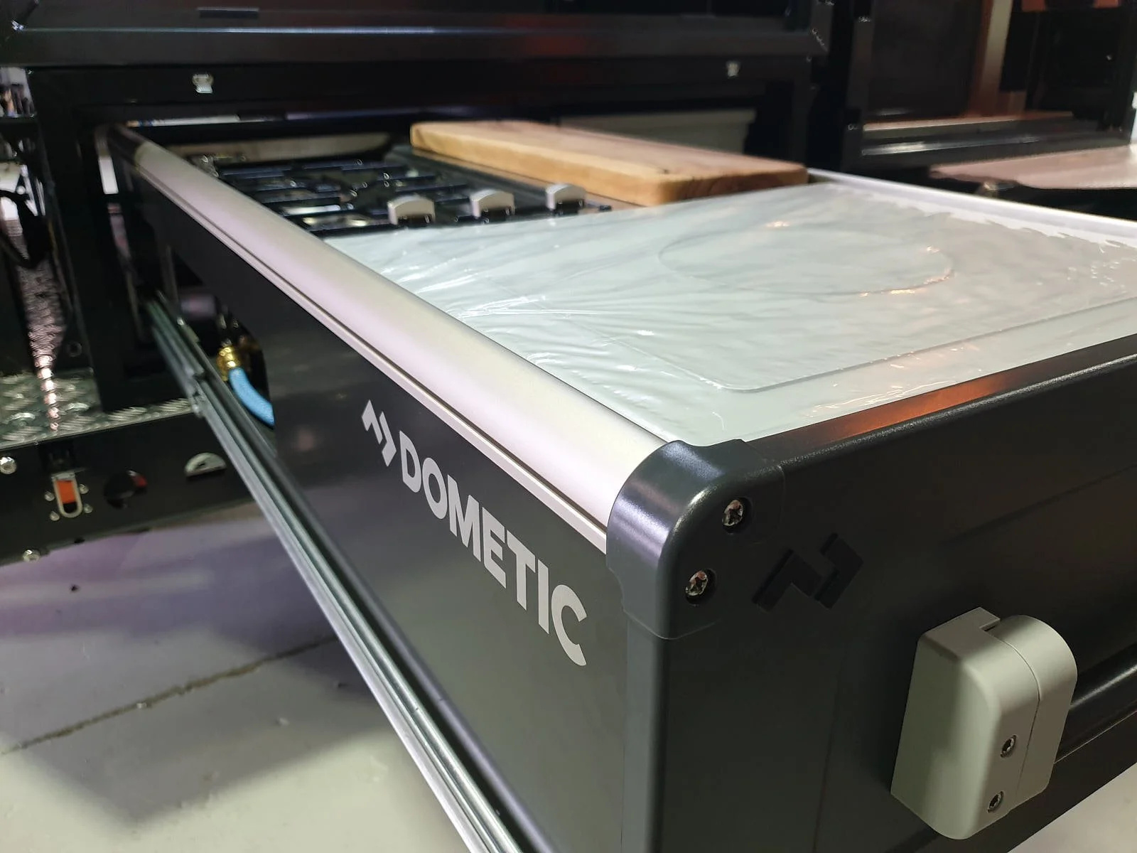   The Large Dometic slide out kitchen provides bench space, 3 burner stove and a sink with hot and cold water and is a fantastic addition to your LOKR fit-out. 
 Dometic Slide Out Kitchen  