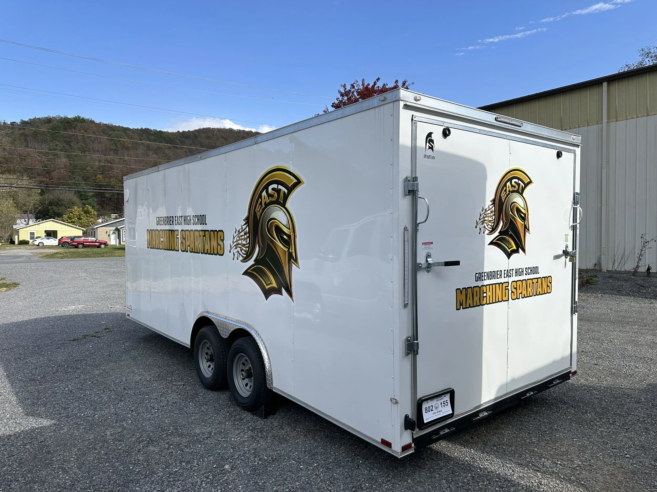 Colorful abstract geometric background with various shades of teal and dark blue, featuring rectangular shapes.