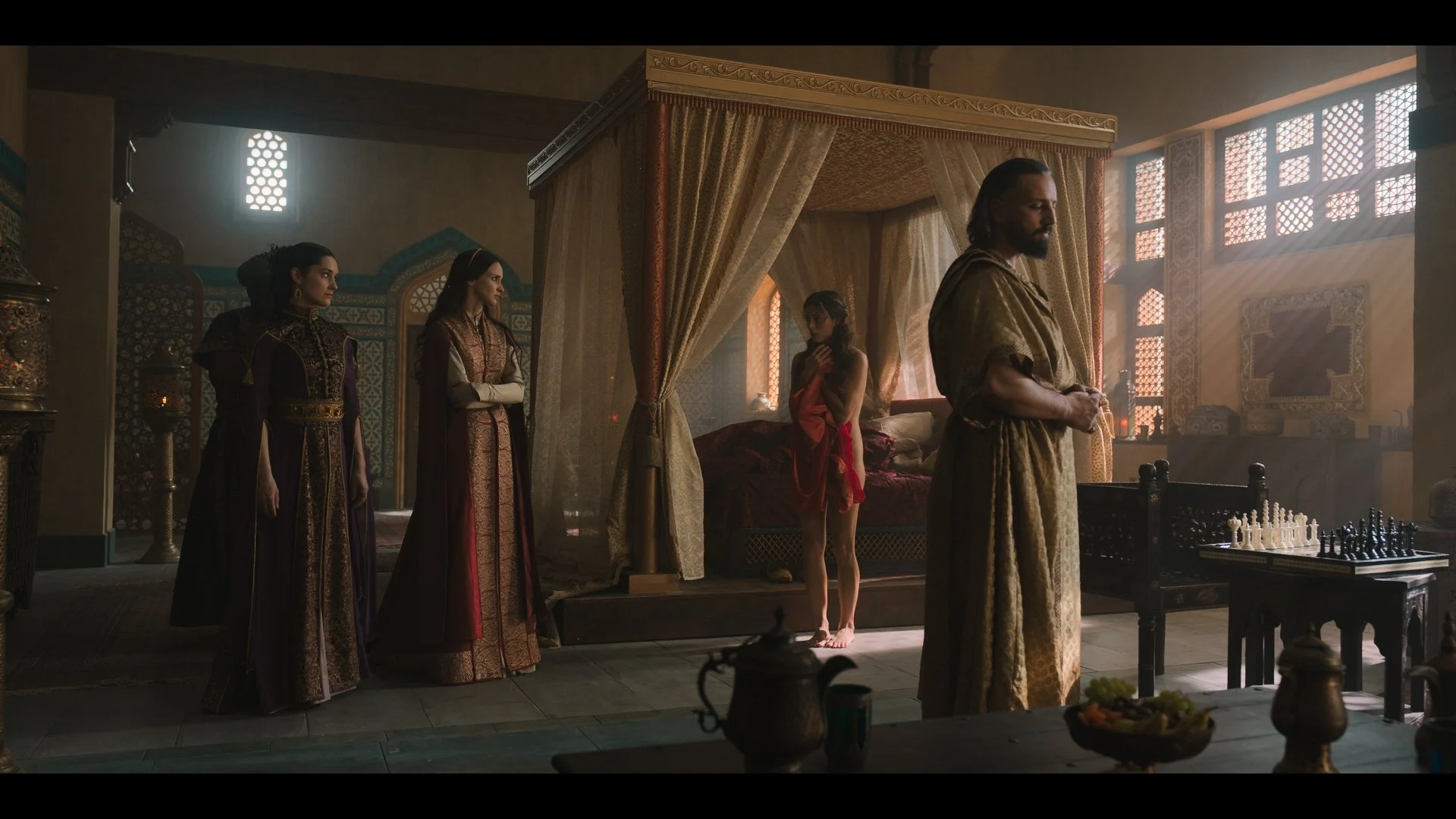 Murathan Muslu as Sultan Murad II in a dimly lit scene from Rise of the Raven. Cinematography by Daniel Garas.