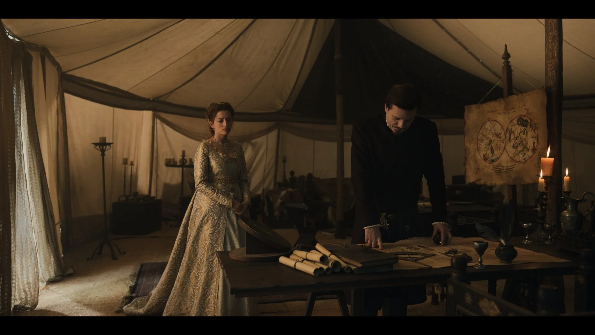 Ernő Fekete as Ulrich Cillei and Mariann Hermányi as Elizabeth of Luxembourg in a candlelit military tent. A still from Rise of the Raven. Cinematography by Daniel Garas.