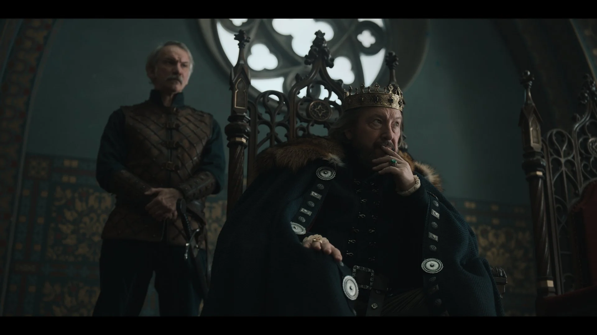 Zsolt László as Simon Kamonyai stands beside László Gálffi as King Sigismund in the throne room of Buda Castle. A still from Rise of the Raven. Cinematography by Daniel Garas.
