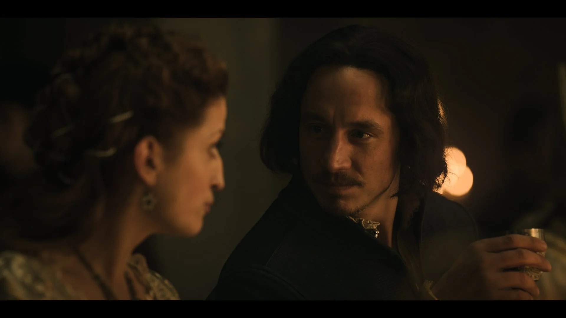 Mariann Hermányi as Elizabeth of Luxembourg and Laurence Rupp as Albert of Habsburg at a banquet in Buda Castle. A still from Rise of the Raven. Cinematography by Daniel Garas.
