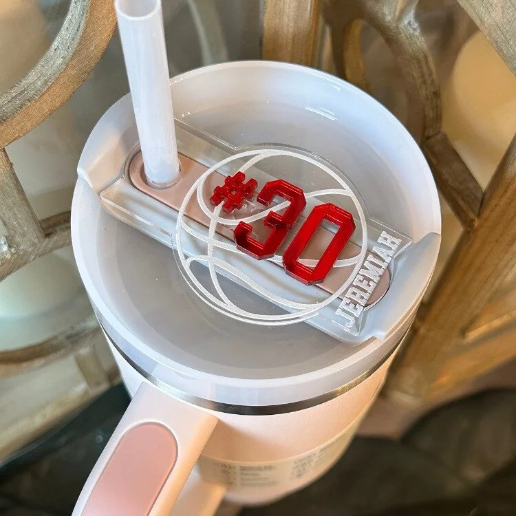 Support your athlete by unleashing your inner sports fanatic and adding a dash of personalized flair to your tumbler with our Sports Stanley Name Plate! 🏈⚾ Show them that you are their biggest fan, this Tumbler Lid Name Plate is the ultimate cup acc